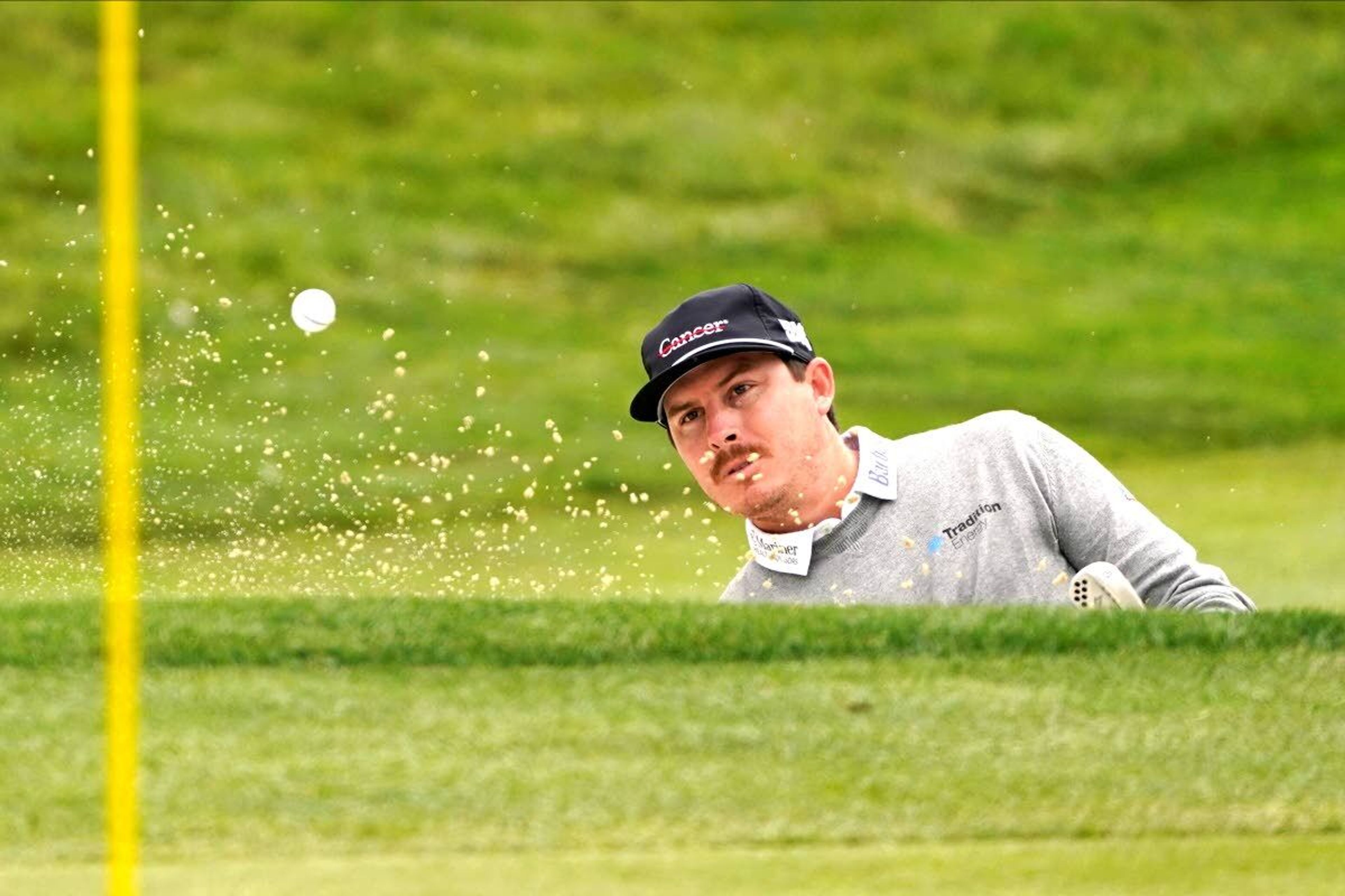 Joel Dahmen hits from the bunker on the fourth hole during the final round of the PGA Championship golf tournament at TPC Harding Park Sunday, Aug. 9, 2020, in San Francisco. (AP Photo/Charlie Riedel)