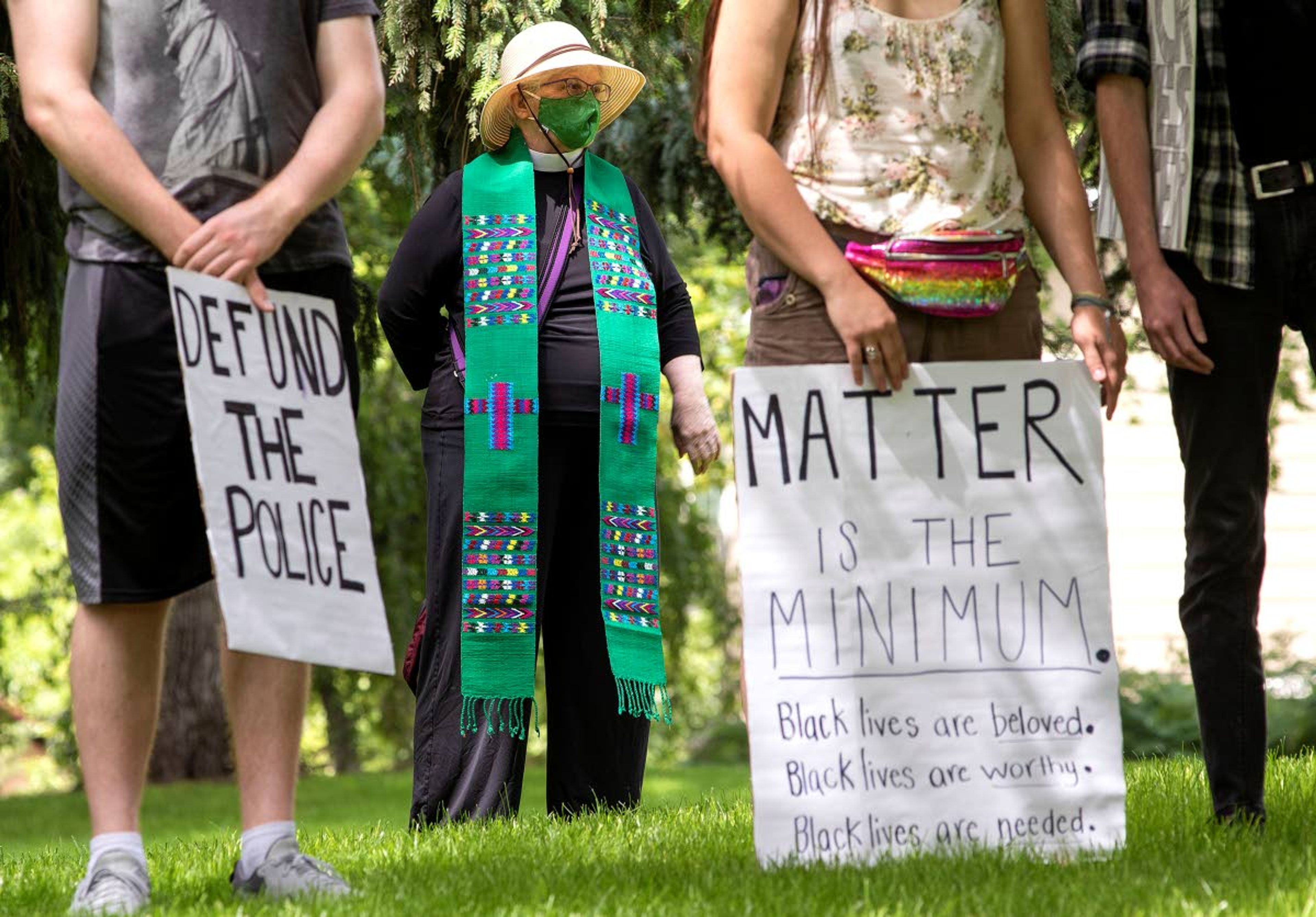 Mary Beth Rivetti and other marches gather in East City Park on Sunday for the Moscow Solidarity March. The event was organized by the Moscow Anti-Racism Alliance. Rivetti is a retired member of the clergy from St. Mark's Episcopal Church in Moscow.