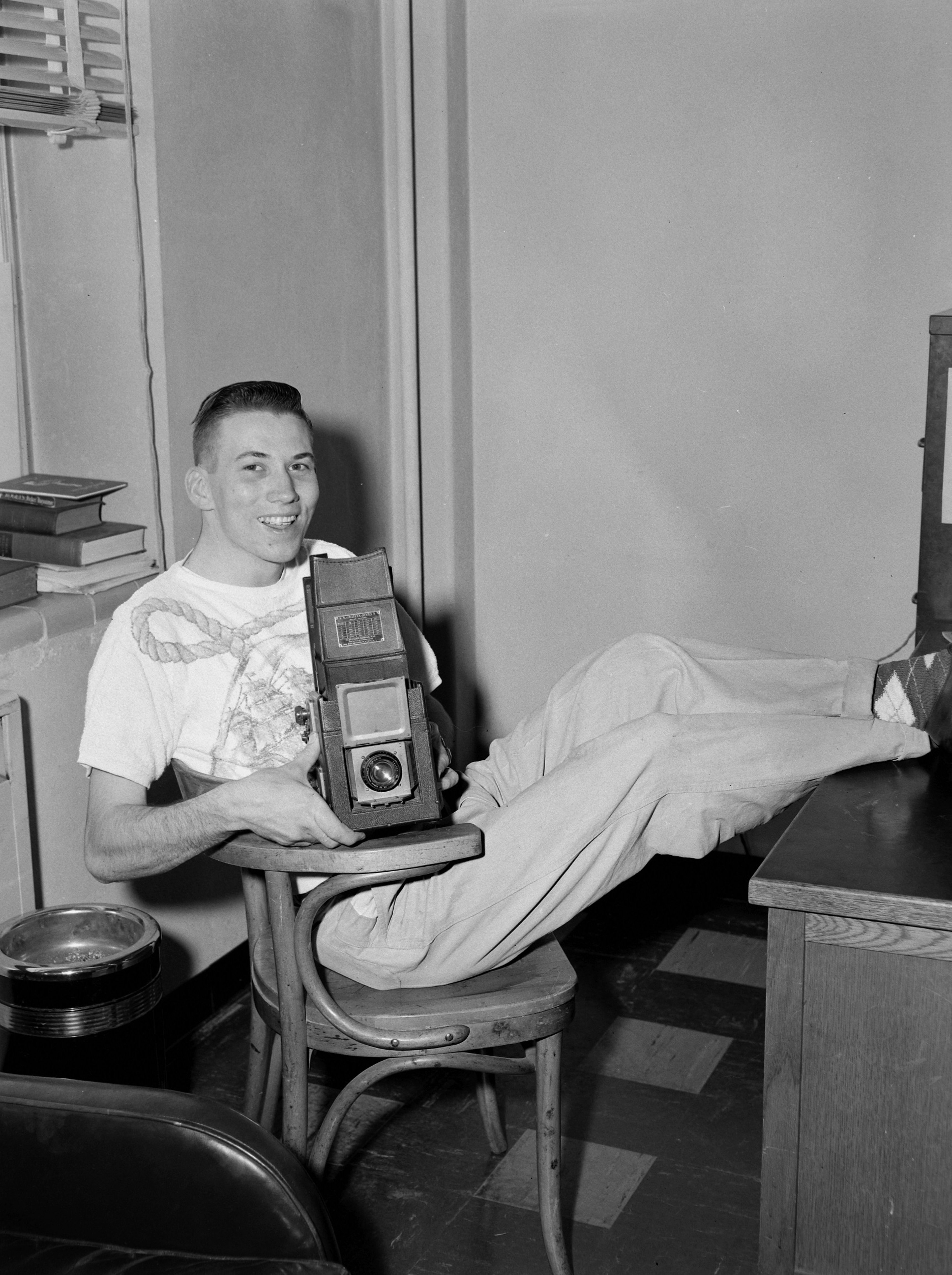 Rick Jones poses with his camera, circa 1952-56.