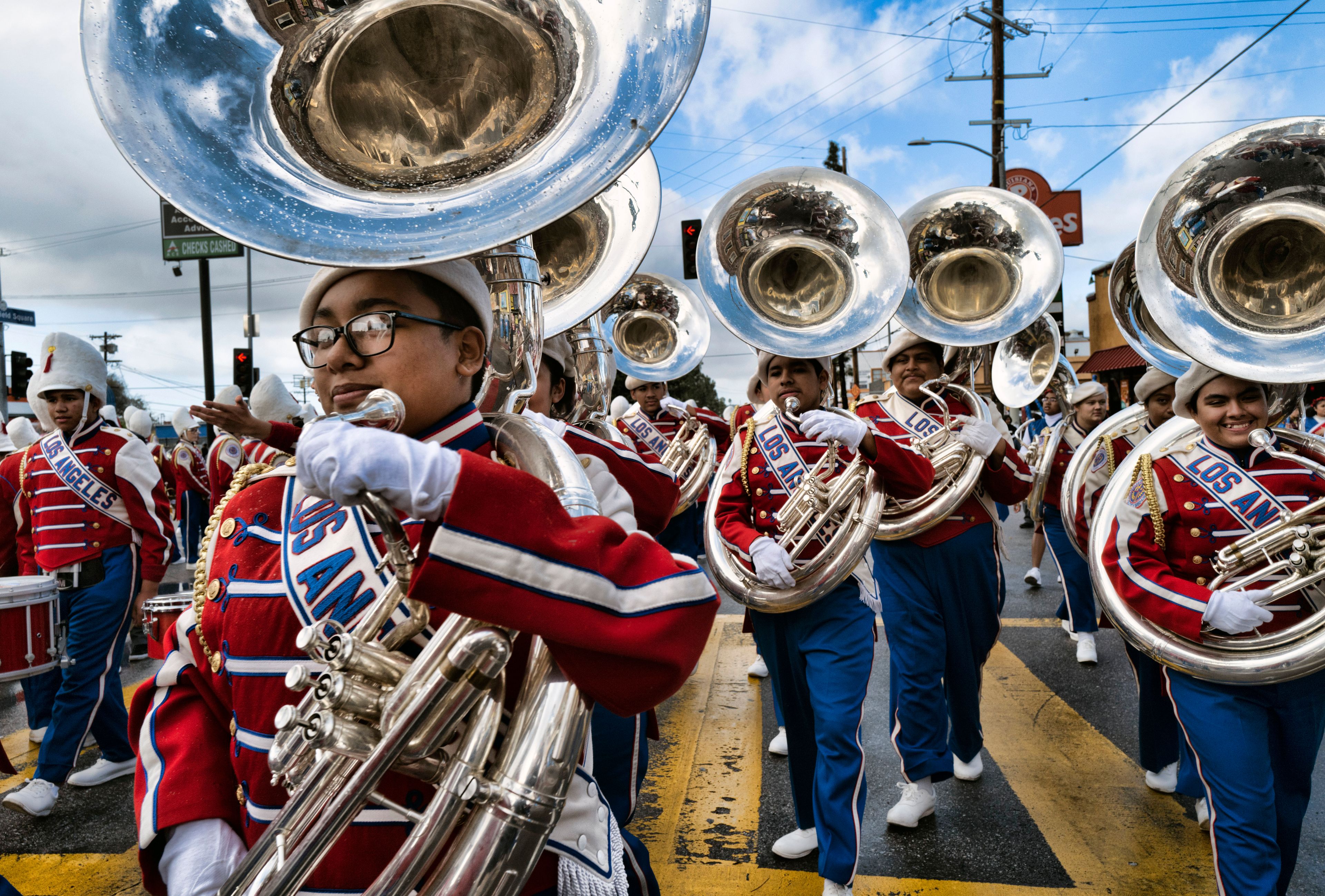 The Los Angeles Unified School District All District High School Honor Band Tuba section join the parade route to participate in the Kingdom Day Parade in Los Angeles, Monday, Jan. 16, 2023. After a two-year hiatus because of the COVID-19 pandemic, the parade, America's largest Martin Luther King Day celebration returned. (AP Photo/Richard Vogel)