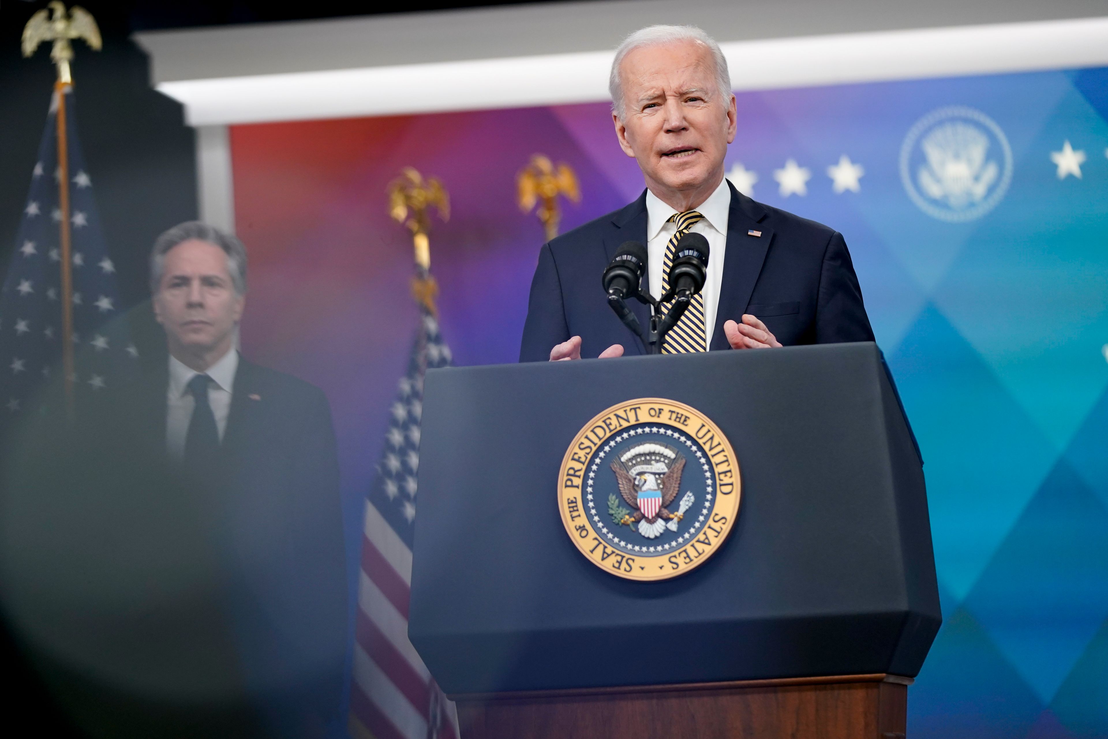 President Joe Biden speaks about additional security assistance that his administration will provide to Ukraine in the South Court Auditorium on the White House campus in Washington, Wednesday, March 16, 2022. Secretary of State Antony Blinken stands at left. (AP Photo/Patrick Semansky)