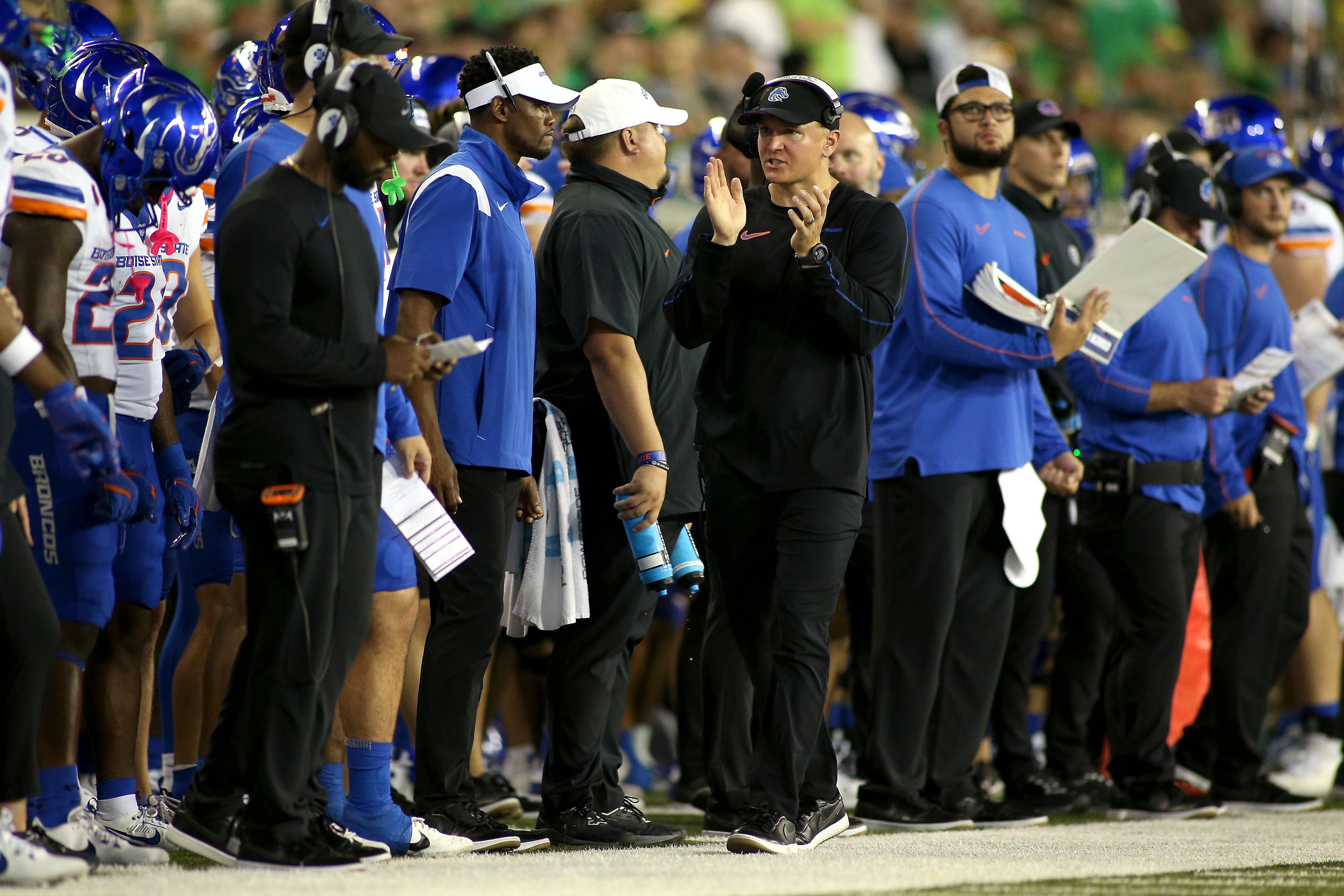 Boise State head coach Spencer Danielson, center, cheers on his team during the first half of an NCAA college football game against Oregon, Saturday, Sept. 7, 2024, at Autzen Stadium in Eugene, Ore. (AP Photo/Lydia Ely)