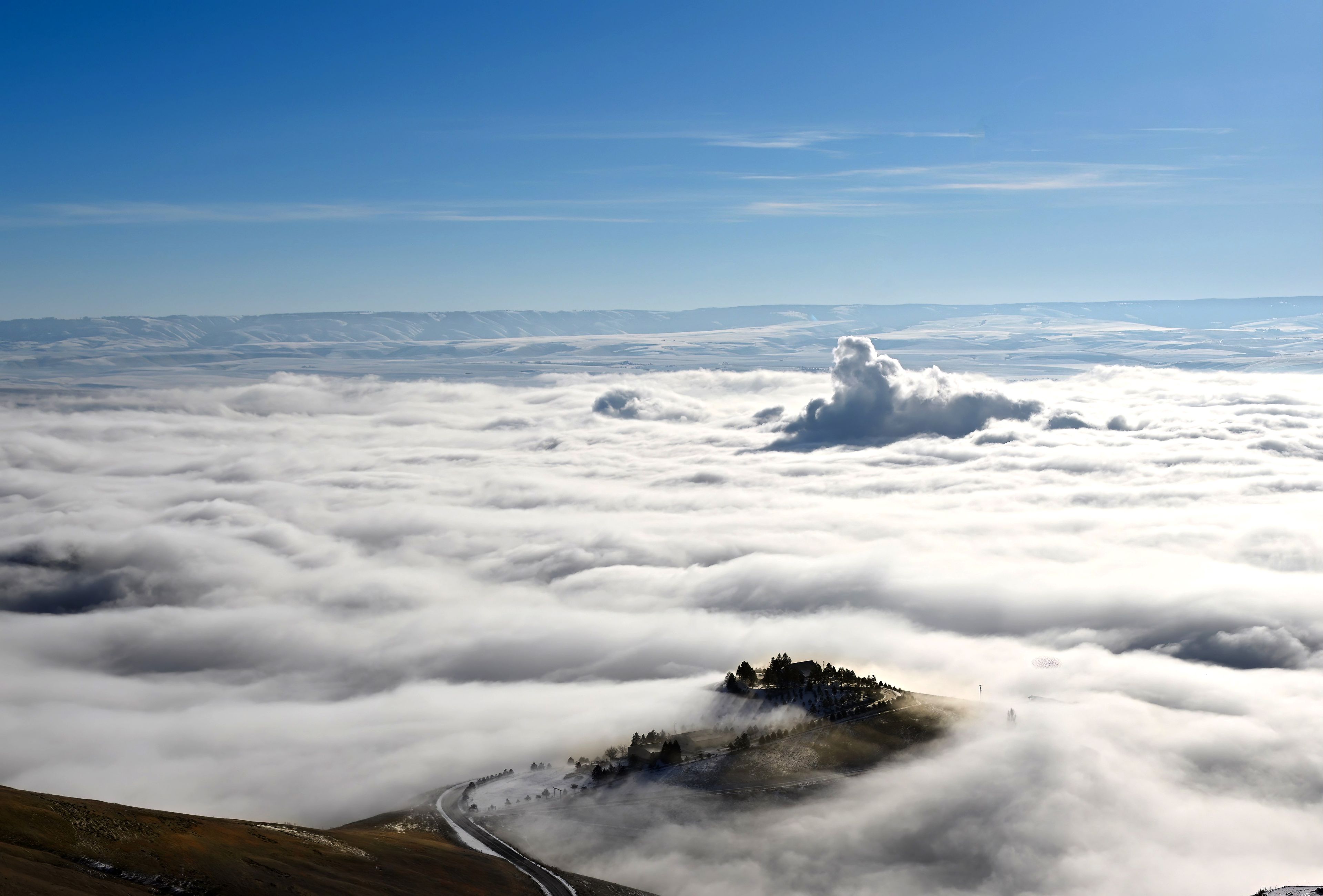 Gail Craig snapped this image recently above the Old Spiral Highway north of Lewiston, the city completely covered with fog and clouds.