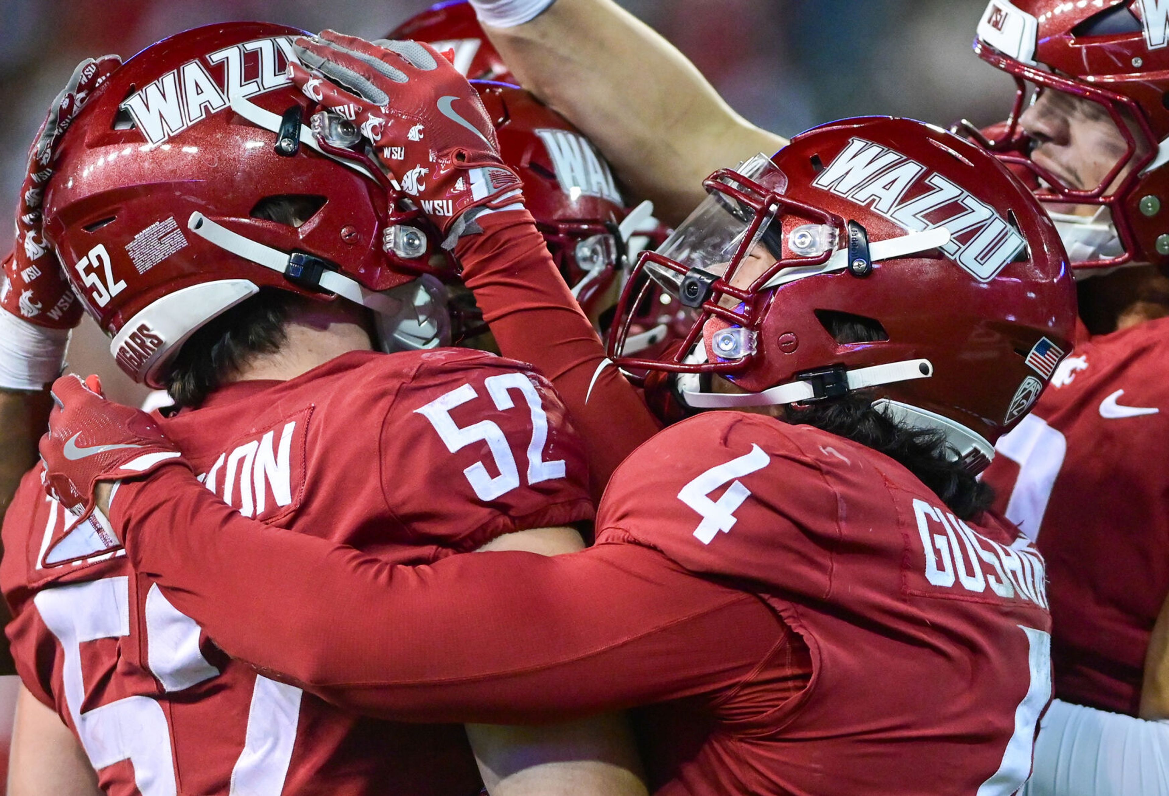 Washington State linebacker Kyle Thornton is celebrated by teammates for an interception against San Jose State Friday in Pullman.