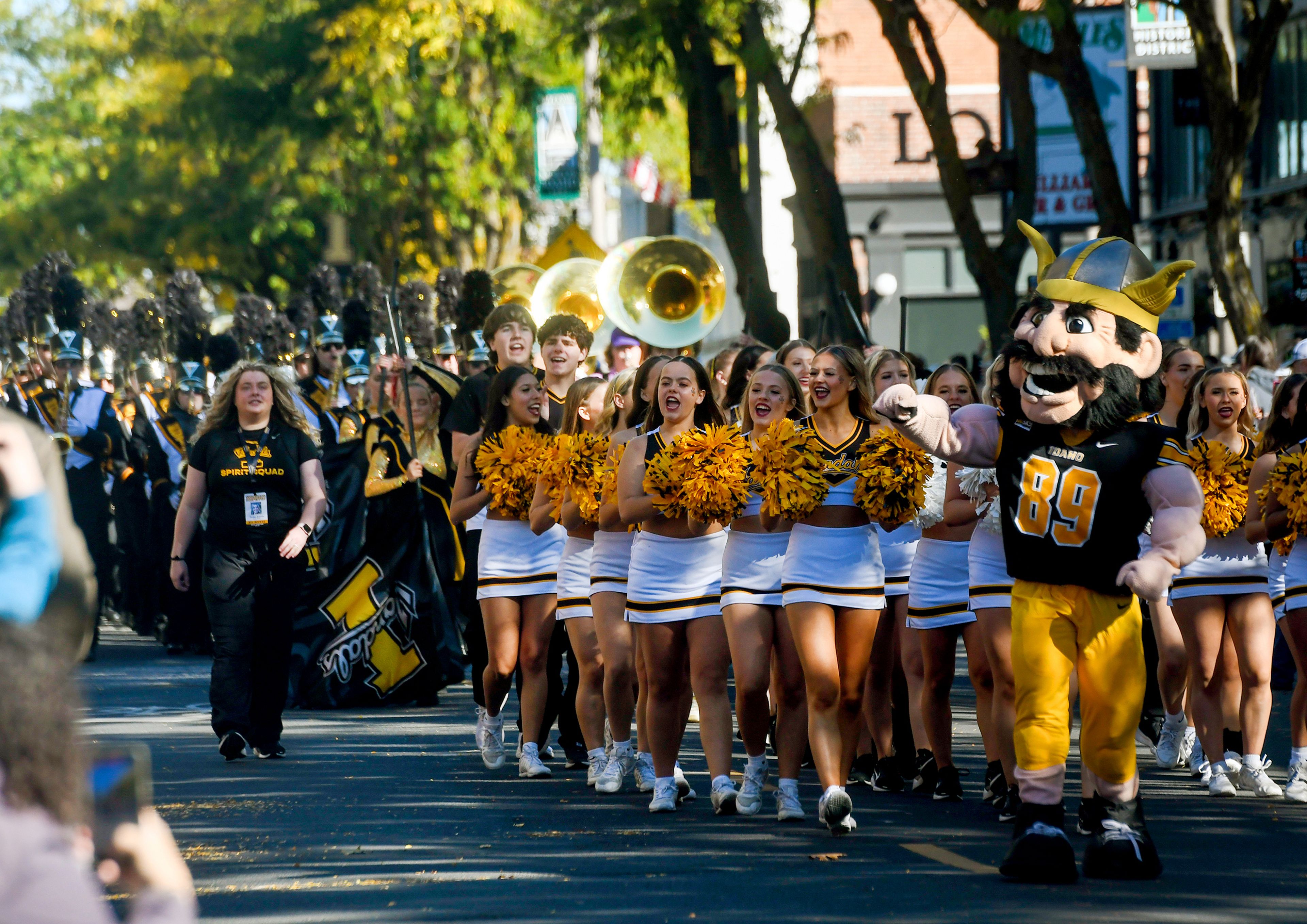 University of Idaho mascot Joe Vandal and the Vandal Spirit Squad make their way down Main Street as part of the Homecoming Parade Saturday in Moscow.