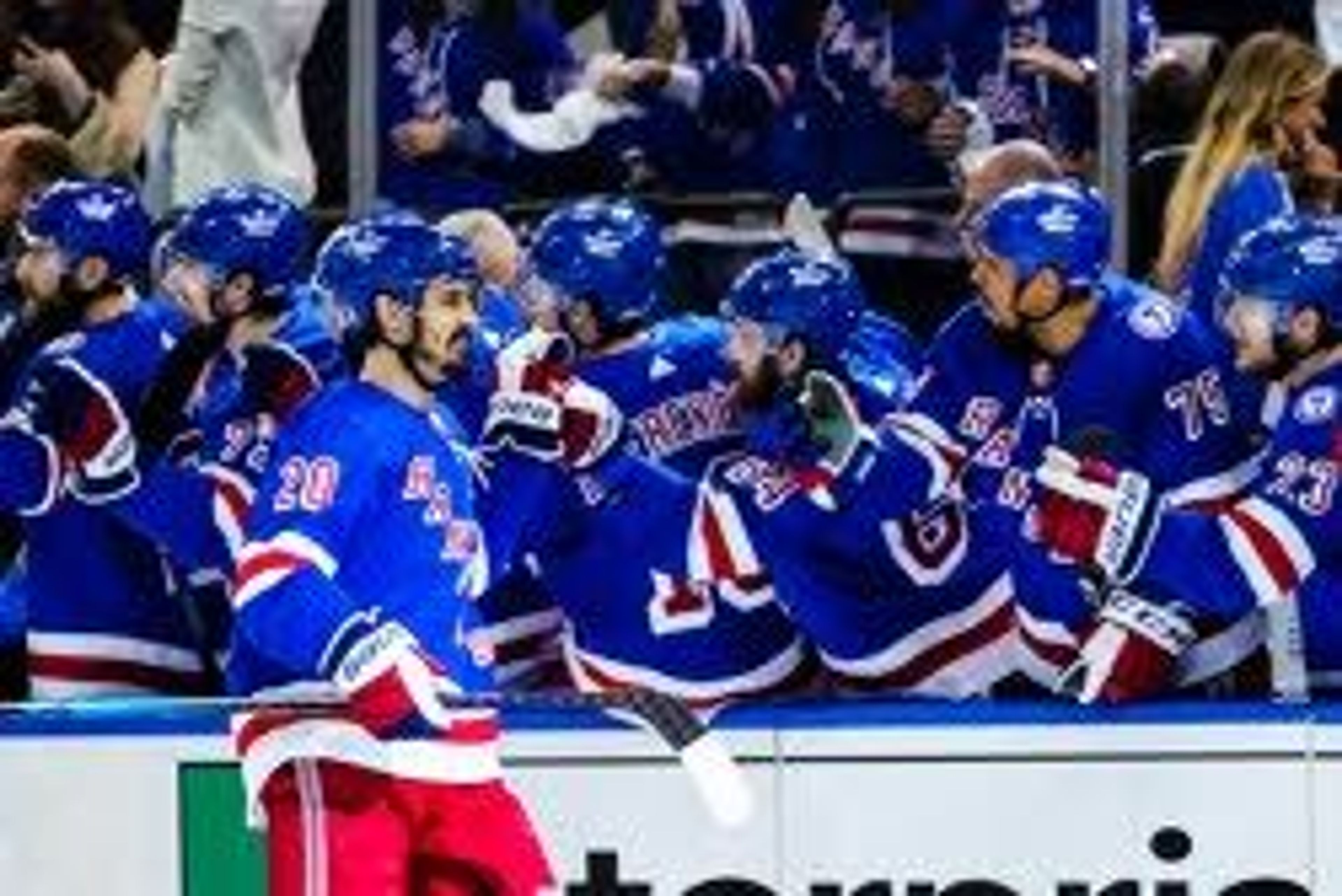 New York Rangers' Chris Kreider (20) is congratulated after scoring a goal against the Tampa Bay Lightning during the first period in Game 1 of the NHL hockey Stanley Cup playoffs Eastern Conference finals Wednesday, June 1, 2022, in New York. (AP Photo/Frank Franklin II)