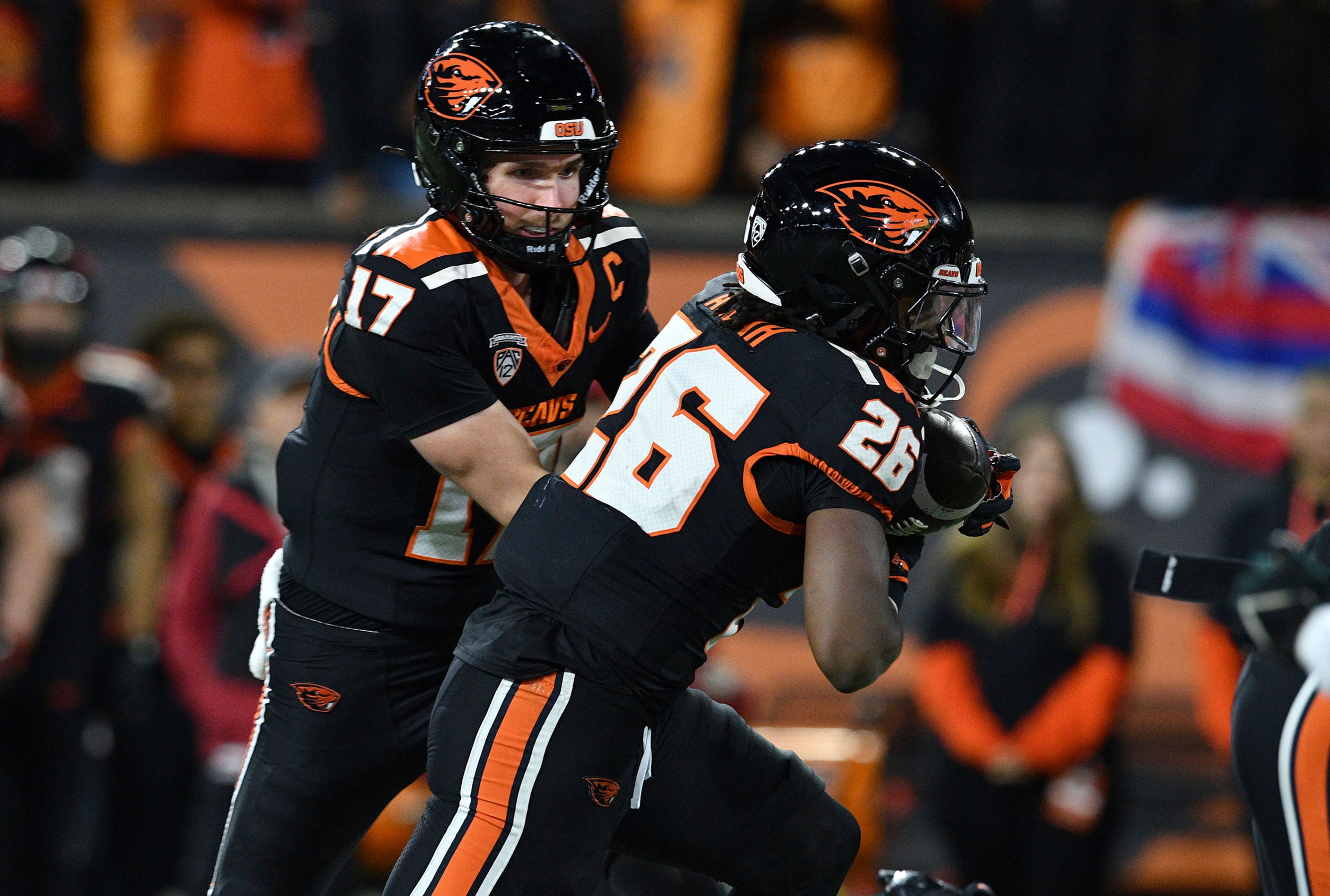 Oregon State quarterback Ben Gulbranson (17) passes to running back Salahadin Allah (26) for a touchdown during the first half of an NCAA college football game Saturday, Nov. 23, 2024, in Corvallis, Ore. (AP Photo/Mark Ylen)