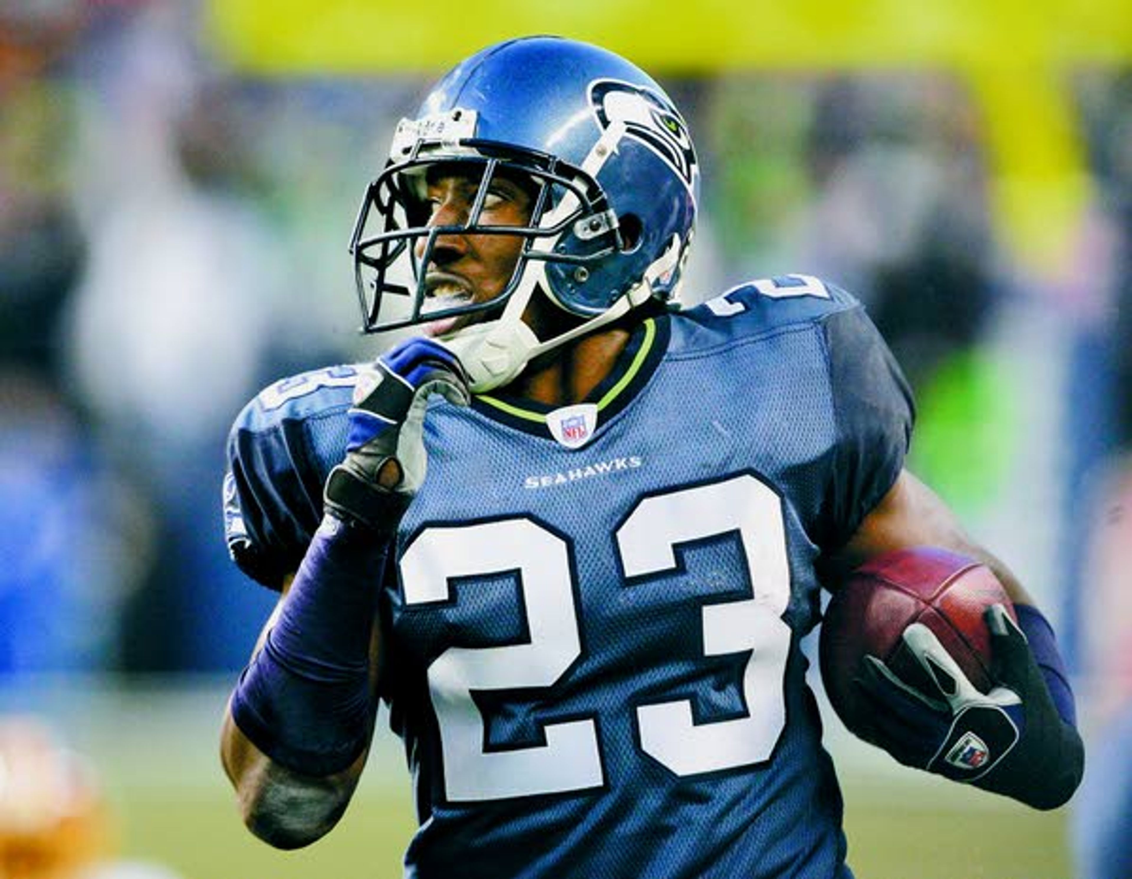 Seahawks’ Marcus Trufant returns an interception for a touchdown against the Redskins in a Jan. 5, 2008, wildcard game in Seattle.