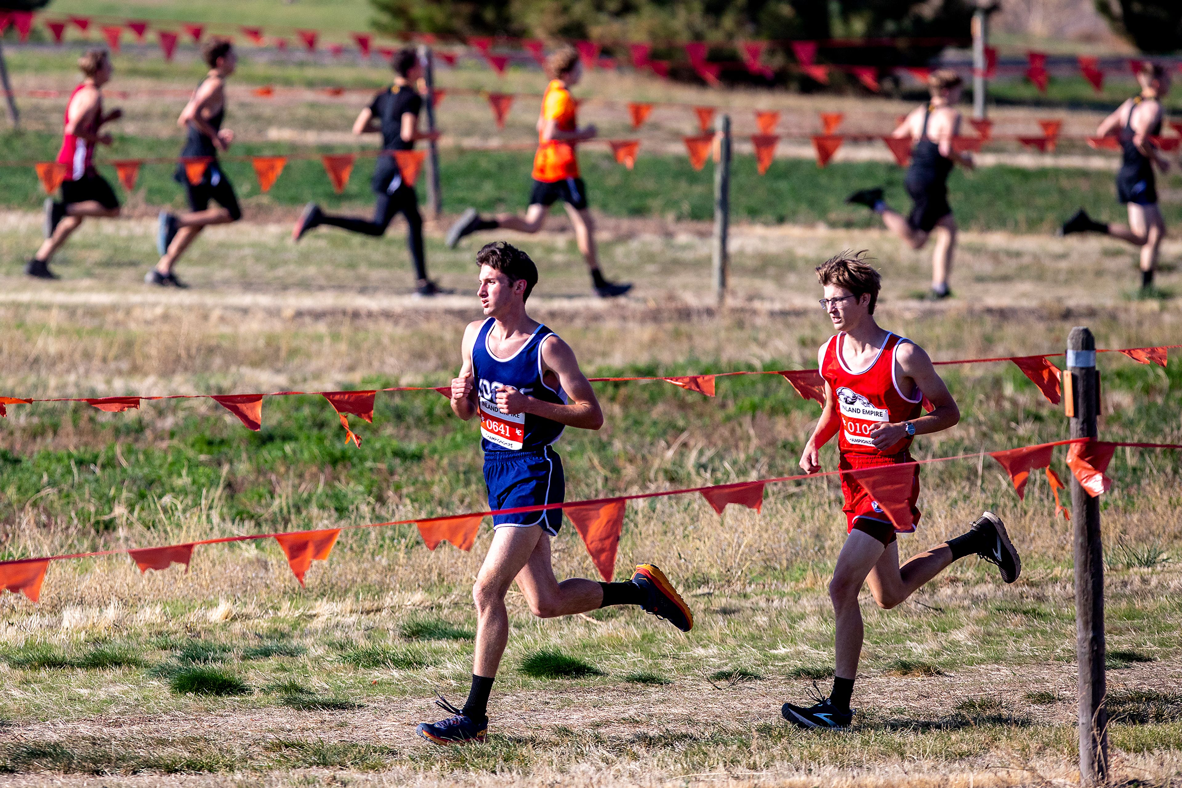 Logos’ Zach Atwood and Clearwater Valley’s Wyatt Anderberg start pulling ahead of the field at the Class 1A district cross country meet in Lewiston on Wednesday.