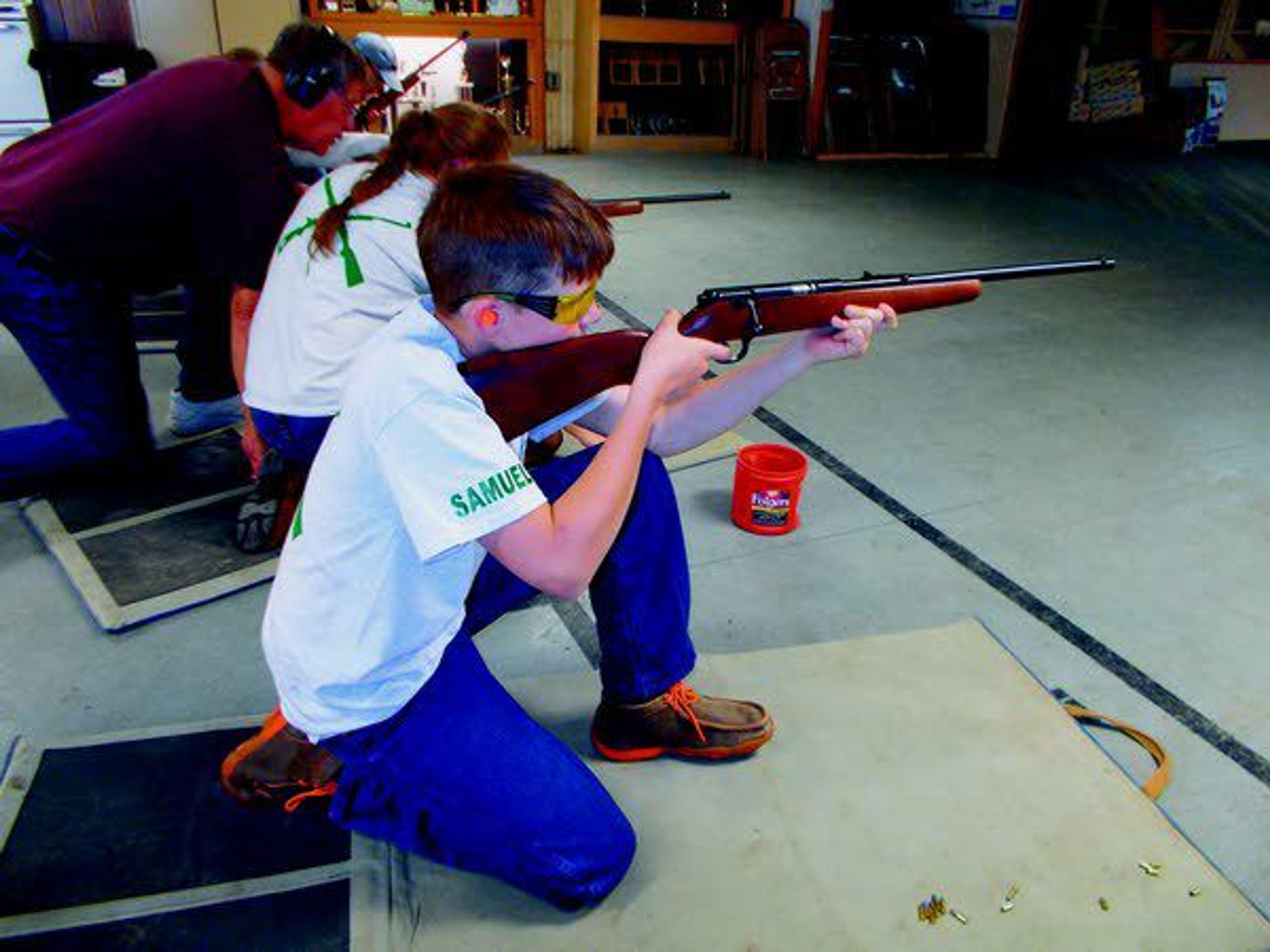 Samuel Barnes looks down the sights of his Savage .22-caliber rifle during a practice for the Latah County 4-H shooting sports program Sunday at the Troy-Deary Gun Club.