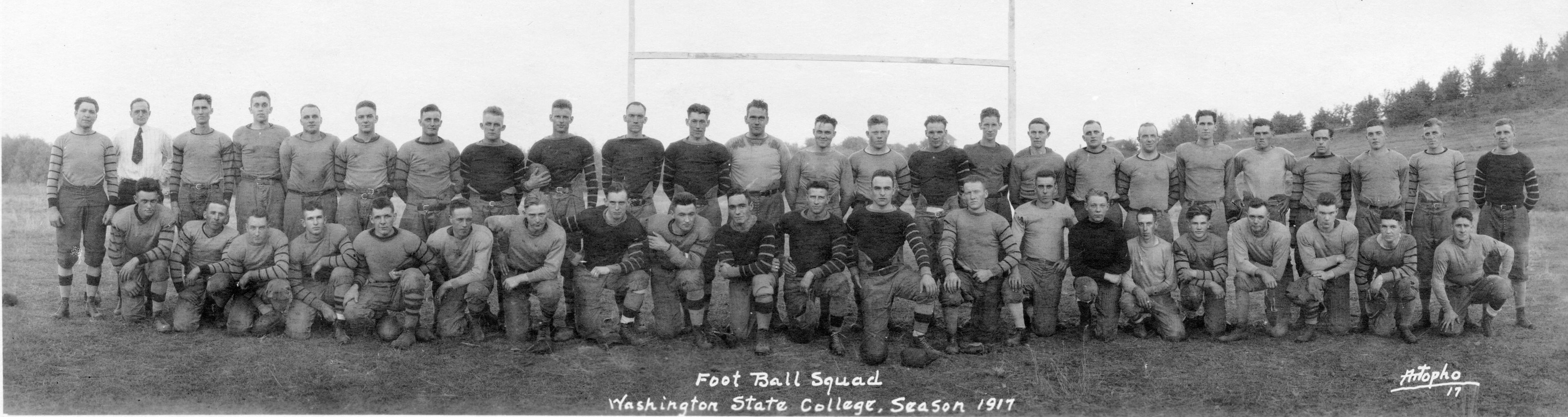 Members of the Washington State College football team of 1917, their first year in the Pacific Coast Conference, line up for a team photo.