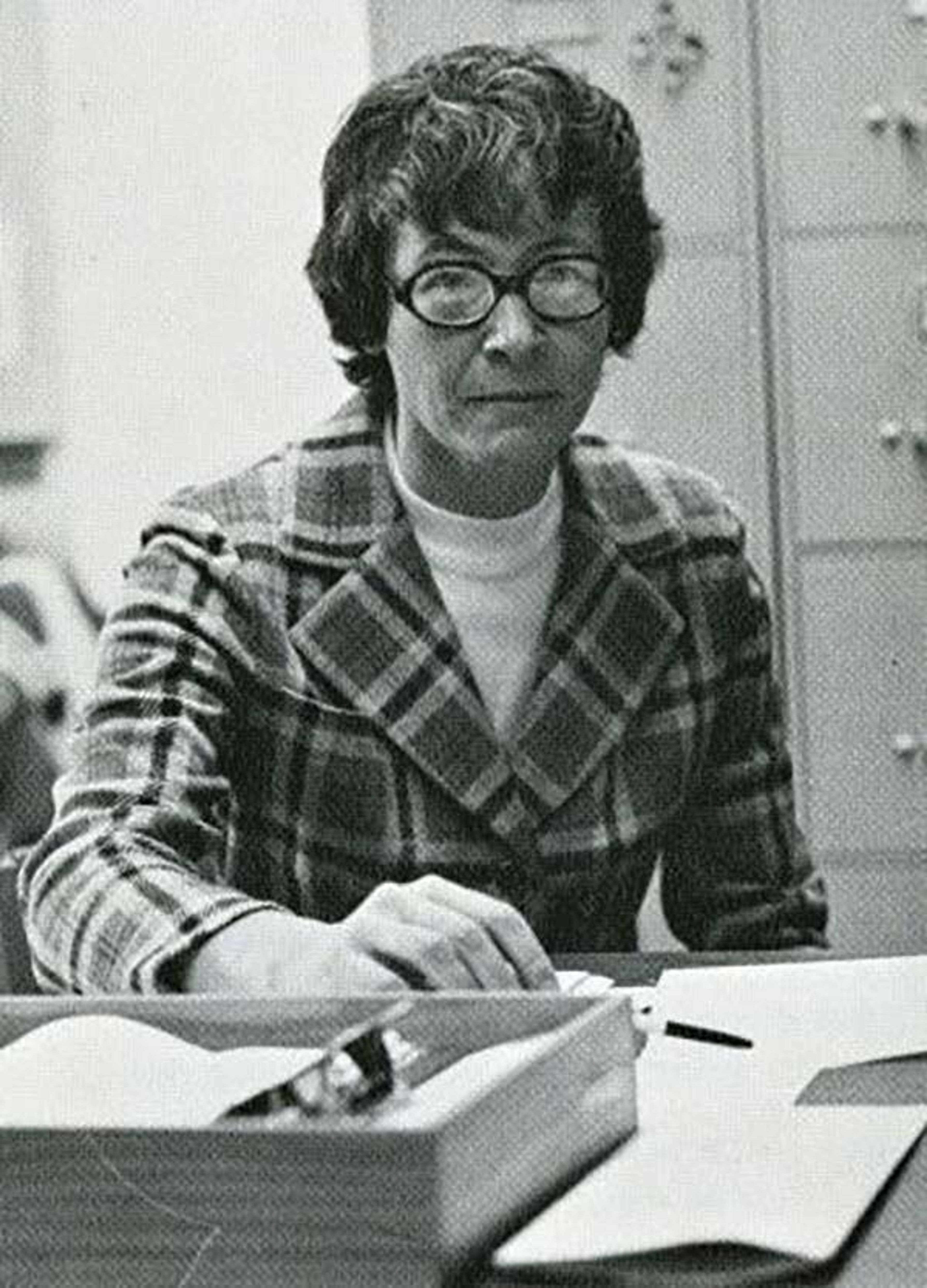 Former Washington State women’s athletic director Joanne Washburn works at her desk in 1975.