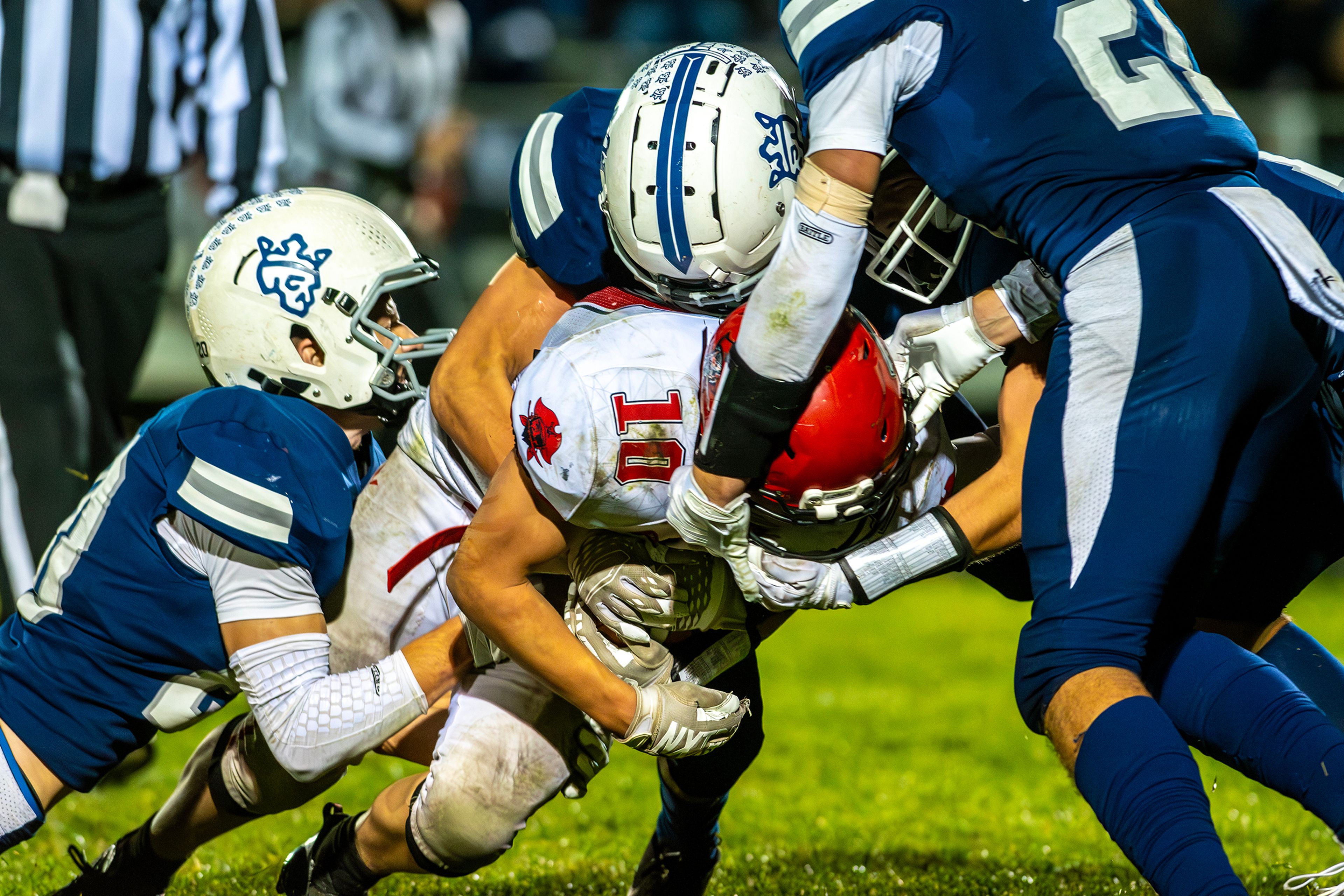 Prairie Chris Schumacher is tackled by numerous Logos players during a conference game Friday in Moscow.,