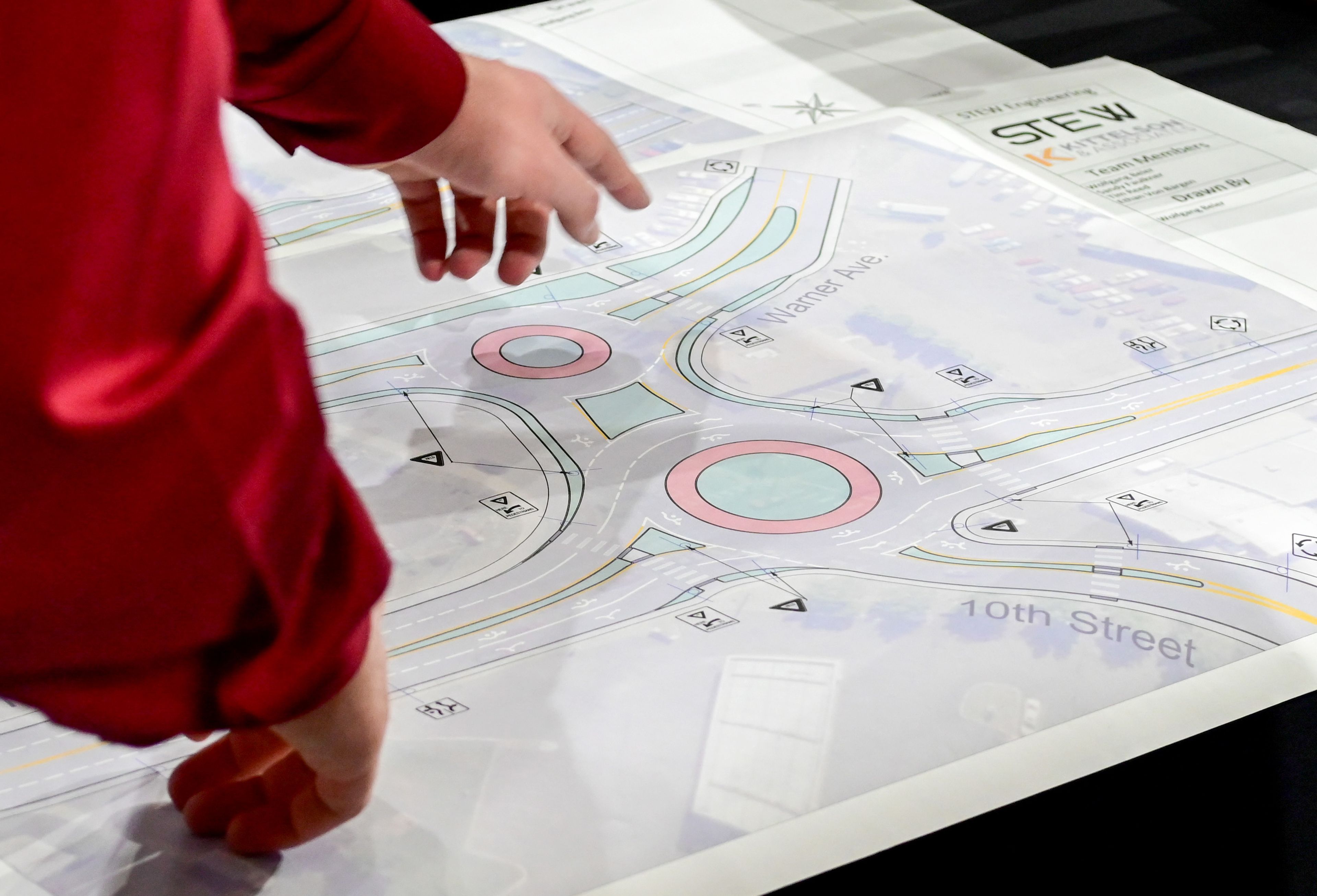 Ethan Von Bargen, a senior civil engineering student at the University of Idaho, points to plans for a redesign project for the Lewiston intersection of Thain Road and 10th Street at the Engineering Design EXPO capstone presentations in Moscow on Friday.