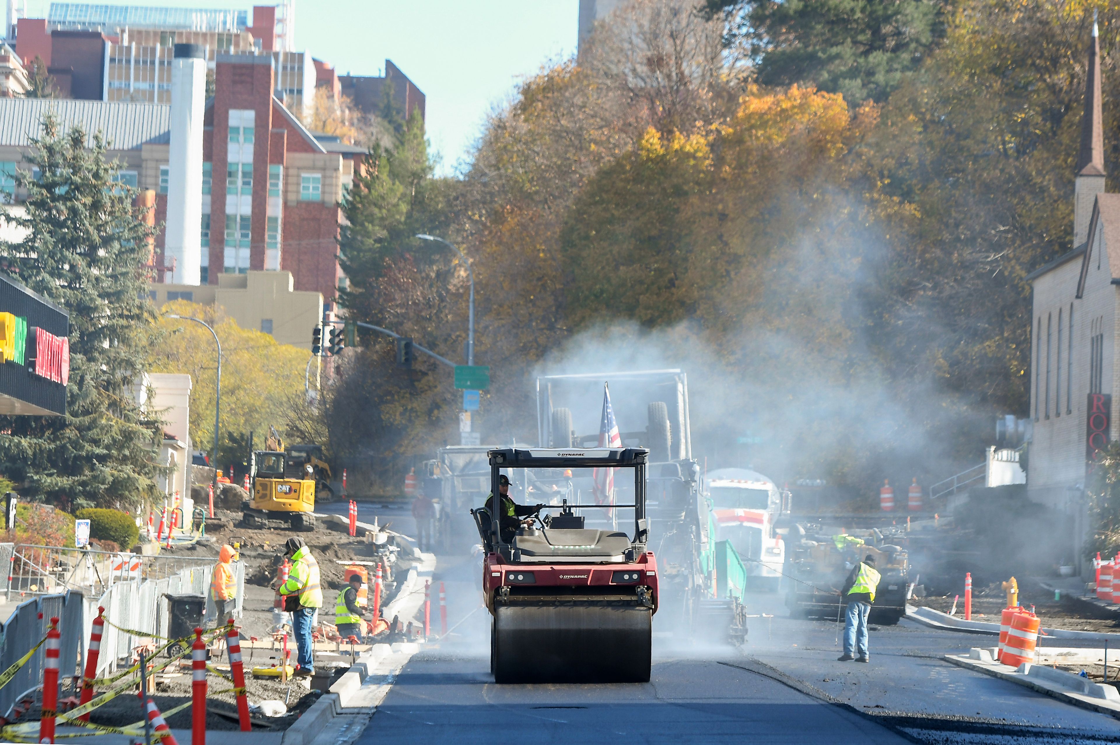 Rollers compact freshly laid asphalt Wednesday along Main Street in downtown Pullman.,