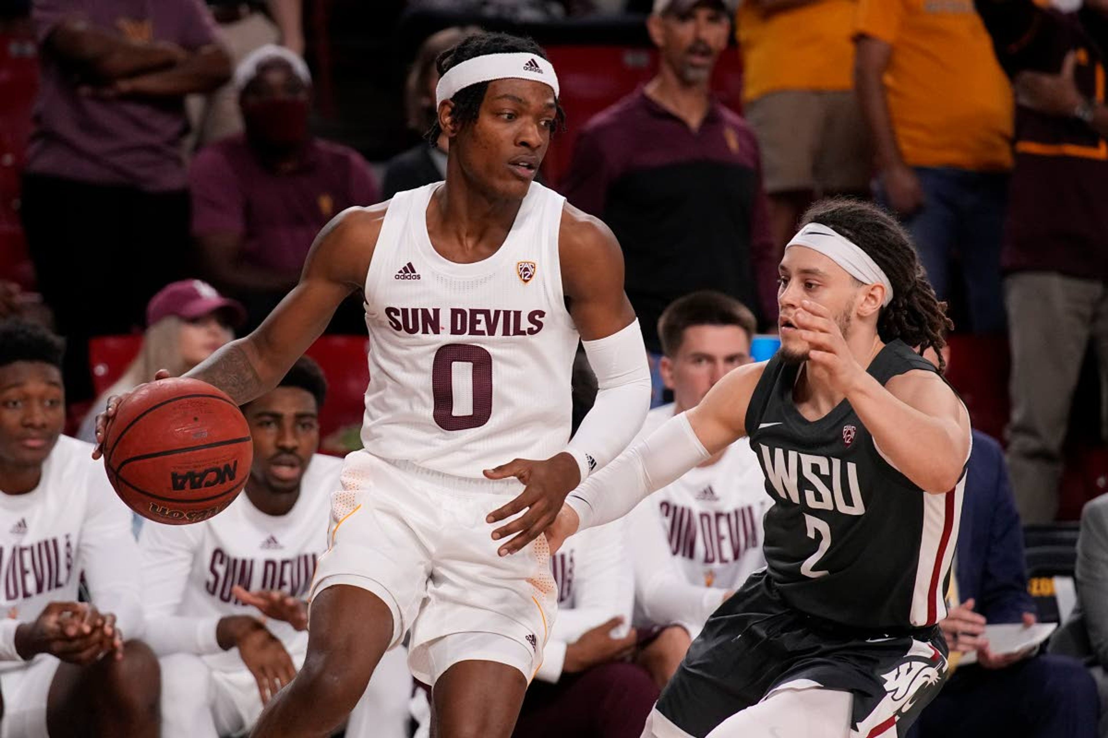 Arizona State guard DJ Horne (0) drives on Washington State guard Tyrell Roberts during the second half of an NCAA college basketball game Wednesday, Dec. 1, 2021, in Tempe, Ariz. Washington State won 51-29. (AP Photo/Rick Scuteri)