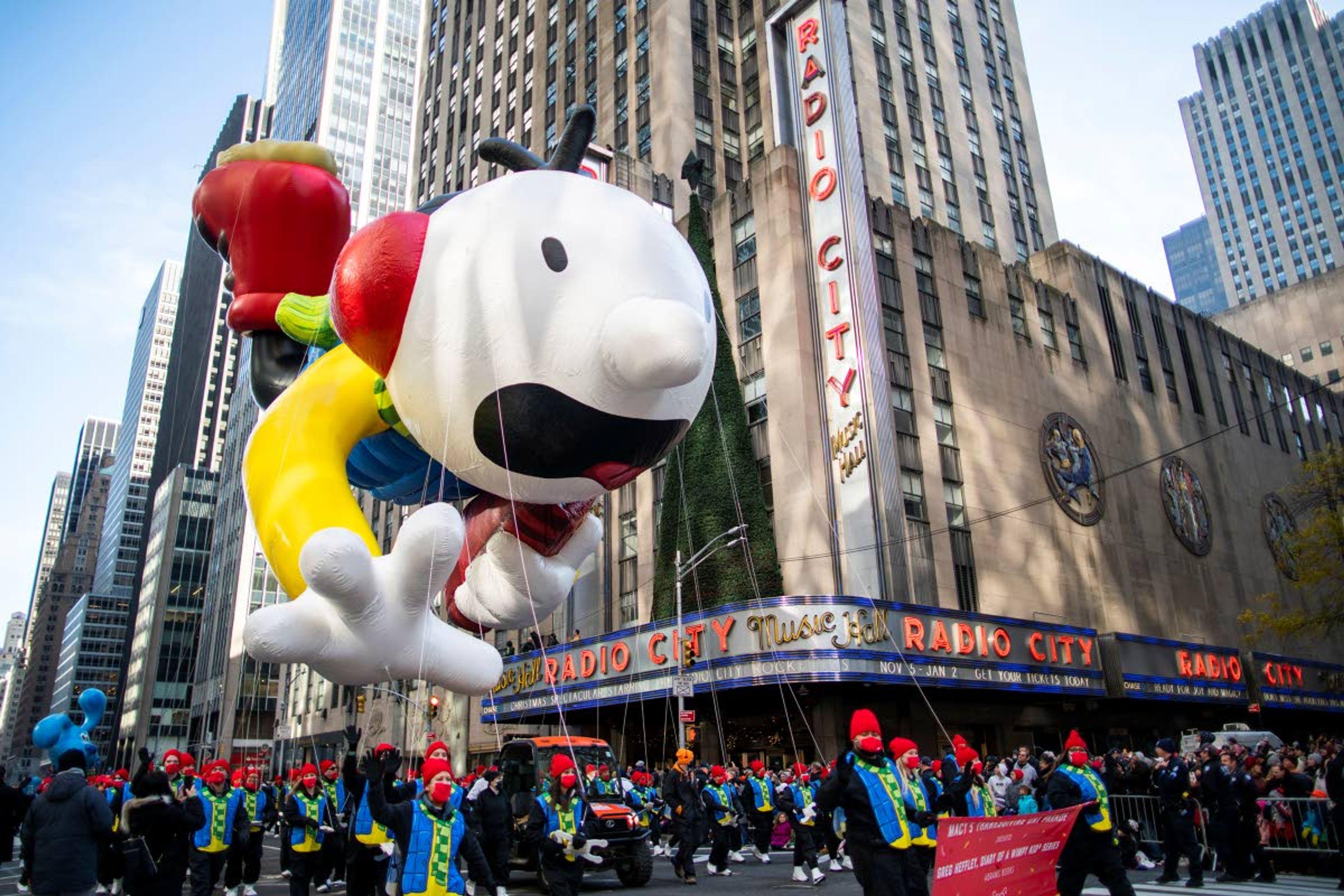 The Greg Heffley "Diary of a Wimpy Kid" balloon floats past Radio City Music Hall during the Macy's Thanksgiving Day Parade, Thursday, Nov. 25, 2021, in New York. AP Photo/Eduardo Munoz Alvarez)