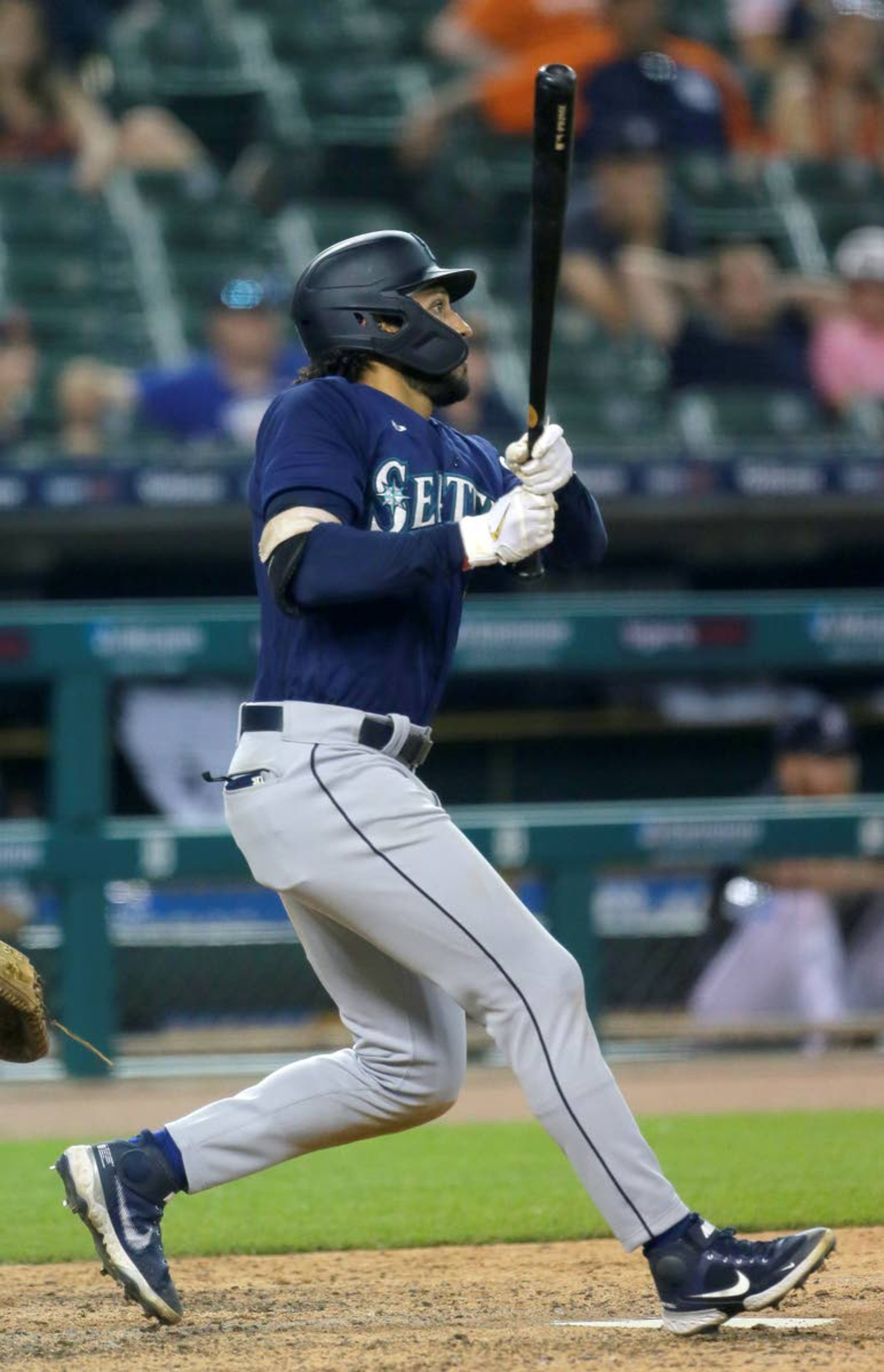 Seattle Mariners' Dillon Thomas watches his two-run single during the 11th inning against the Detroit Tigers in a baseball game Wednesday, June 9, 2021, in Detroit. The Mariners won 9-6. (AP Photo/Duane Burleson)