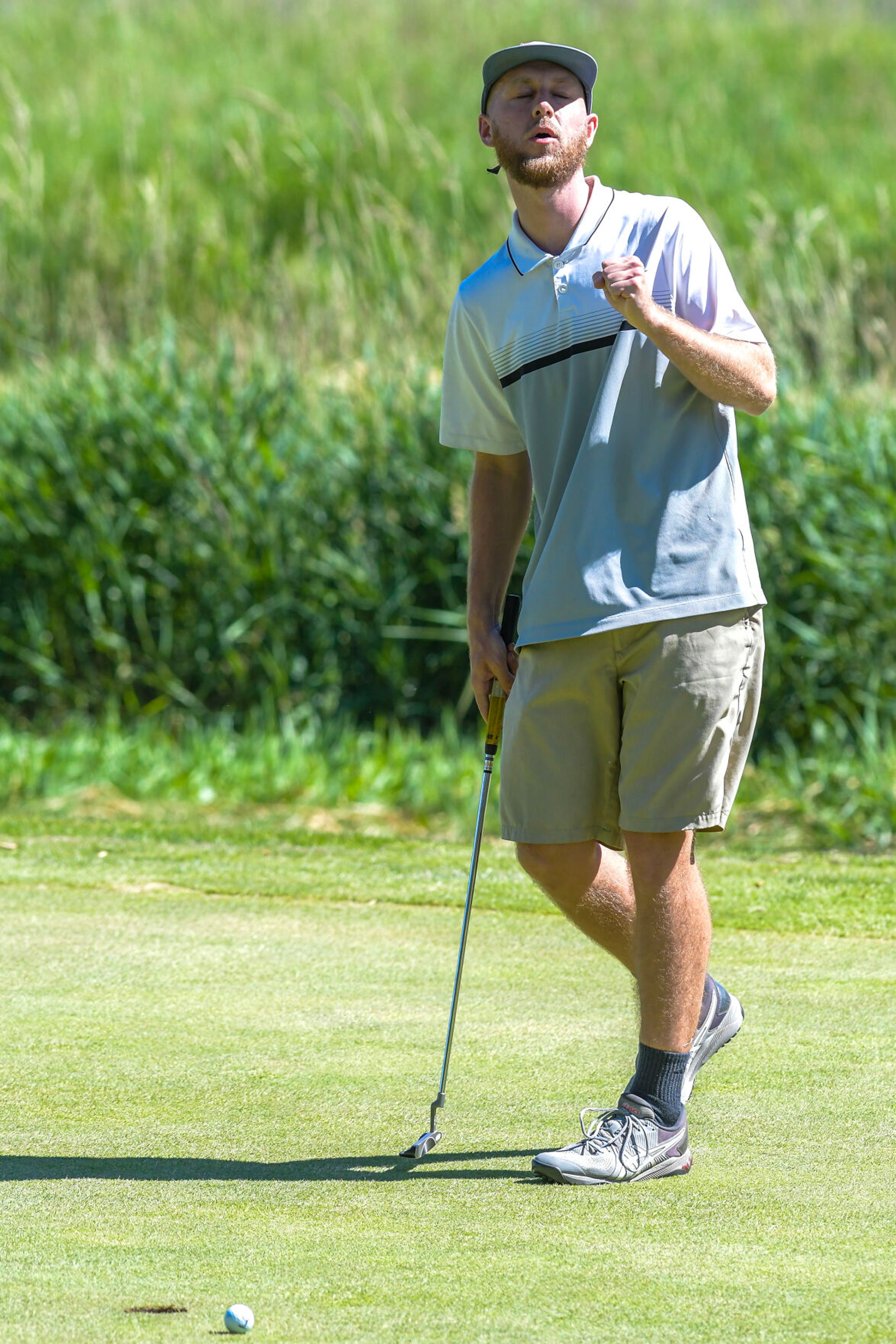 Kyle Peterson reacts as his ball loops around the rim of the hole and doesn’t go in at the annual Moscow Elks Lodge Golf Club Sole Survivor tournament Thursday in Moscow.