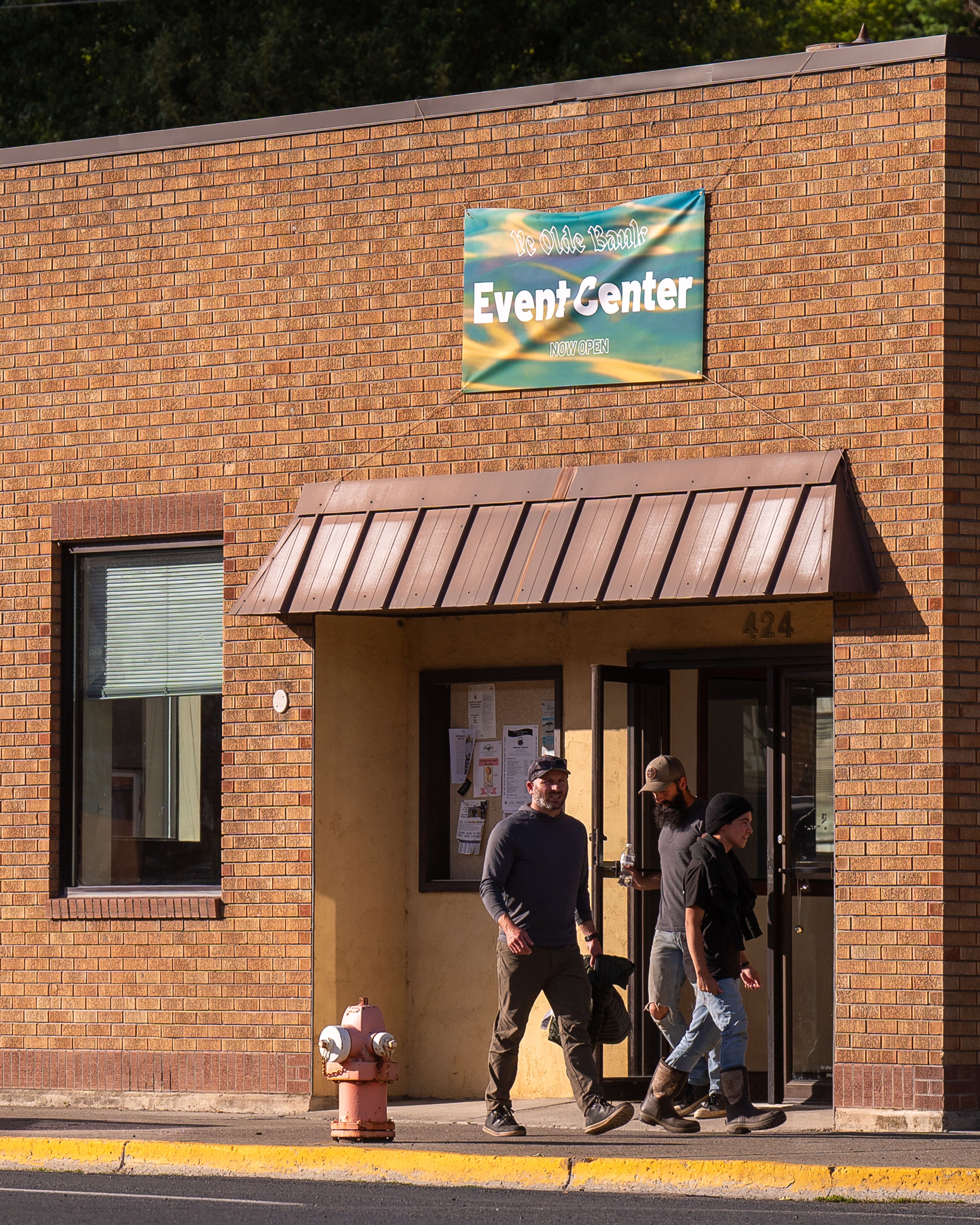 Attendees of the Christ Church ‘Root Beer and Psalms’ singing event exit the Ye Olde Bank Event Center in Troy on Wednesday. Matt Meyer, a Parish Elder at Moscow’s Christ Church, bought the former Umpqua Bank building in November with the goal of allowing the public to hold events in that space, including religious meetings.