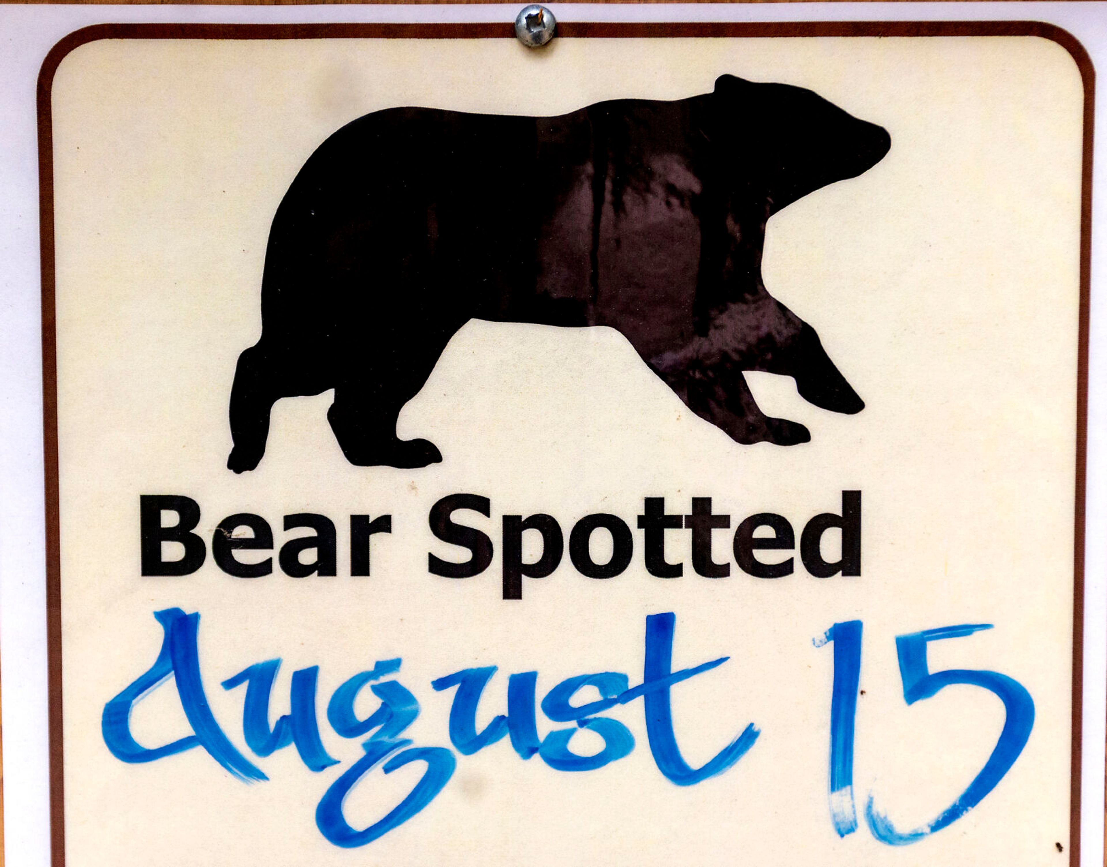 A sign near the Wallowa Lake Trailhead warns people of the last time a bear was sighted in the area outside Joseph, Ore.