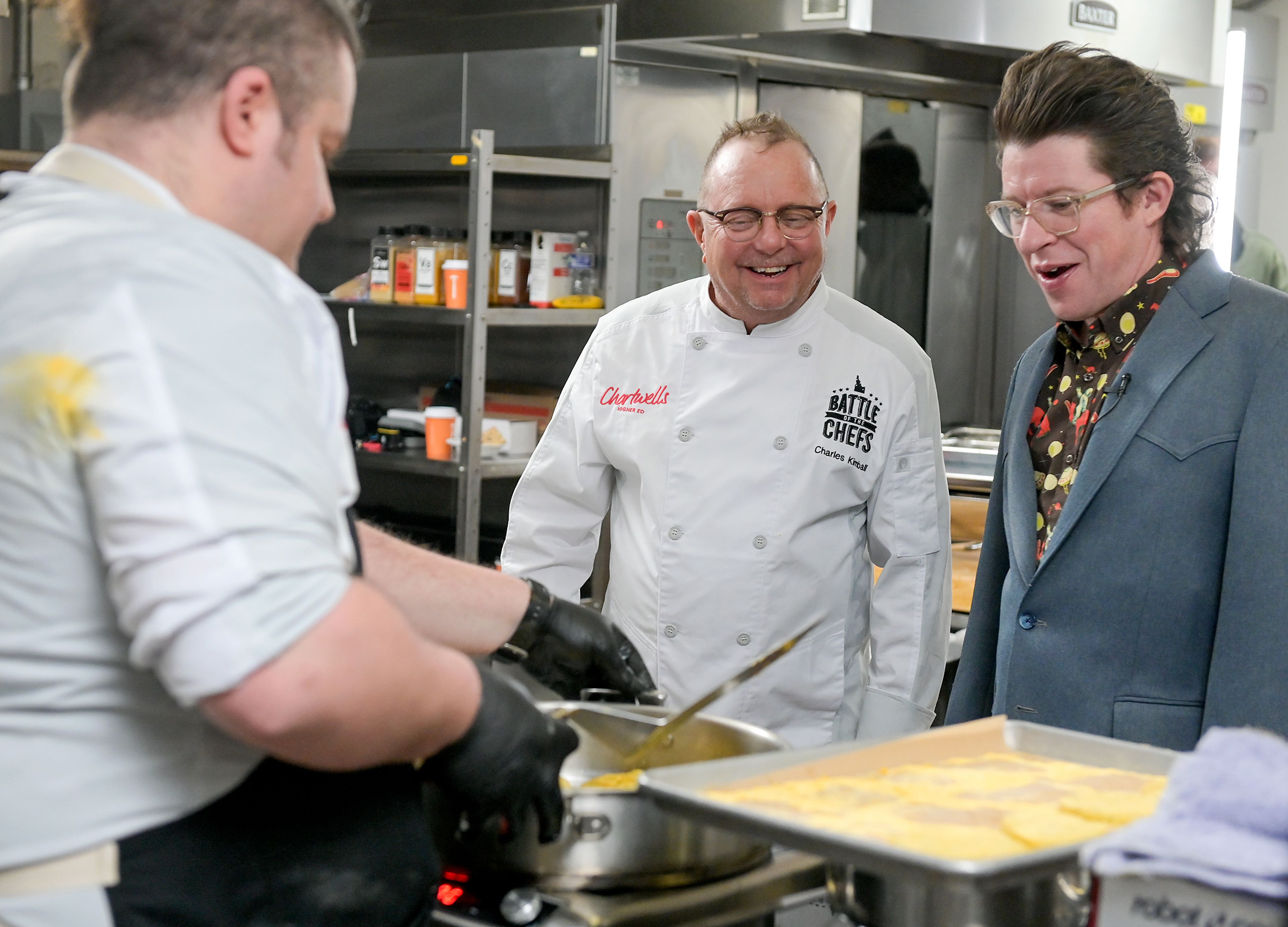 Chef Michael Verk, left, an executive chef with the University of Idaho’s Idaho Eats, shows the dish he is preparing for the Battle of the Chefs Wednesday to Chef Charles Kimball and Chef Justin Warner at The Eatery on campus in Moscow.