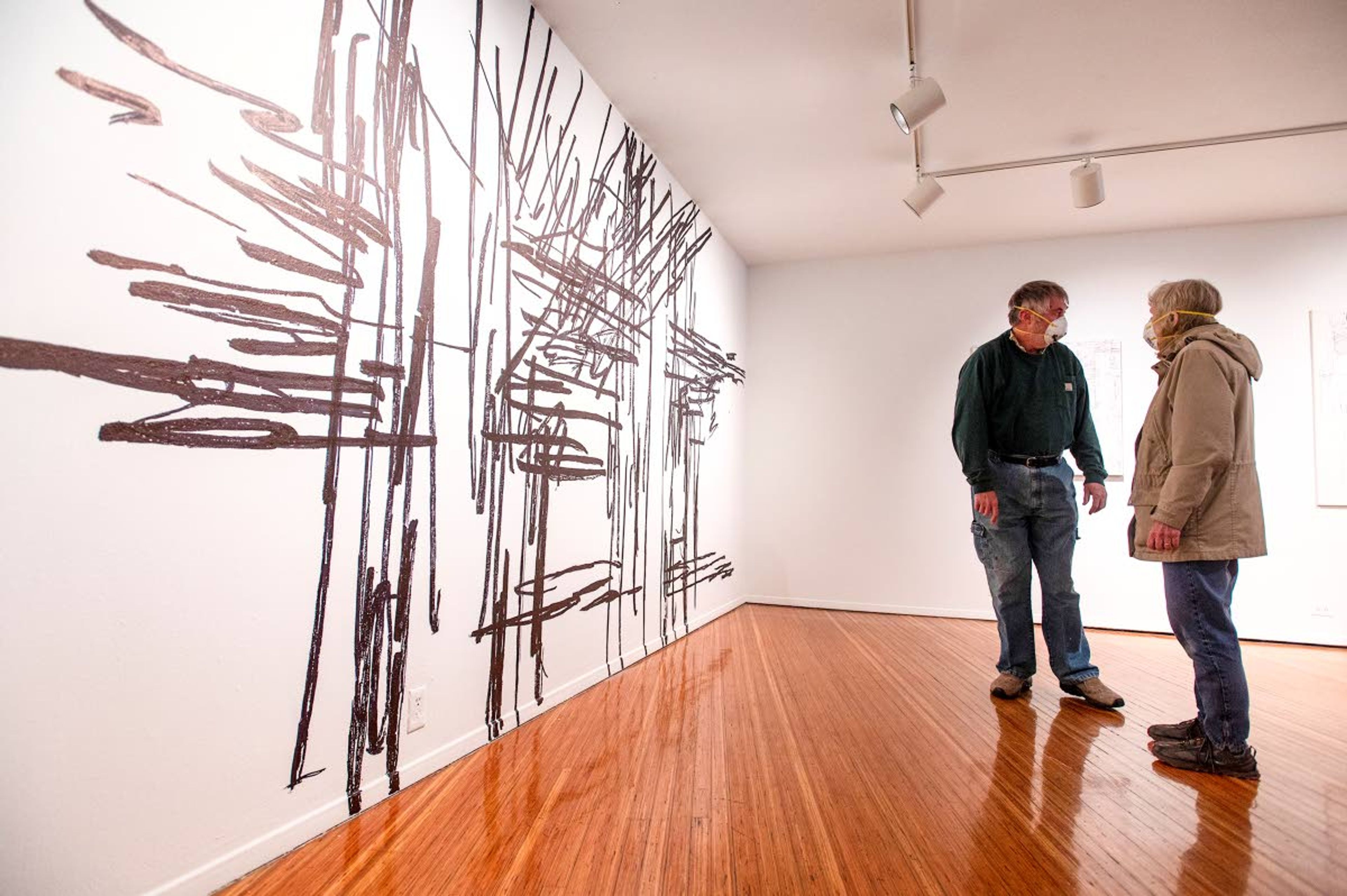 Larry Lass and his wife, Carol, of Troy, examine Moscow Contemporary’s first exhibit, “A Line into the Future” by Gerald Exline on Friday afternoon in downtown Moscow. “It’s always fun to come and see what others are doing. It’s amazing to have a small gallery in Moscow that’s willing to put on this show,” Larry said.