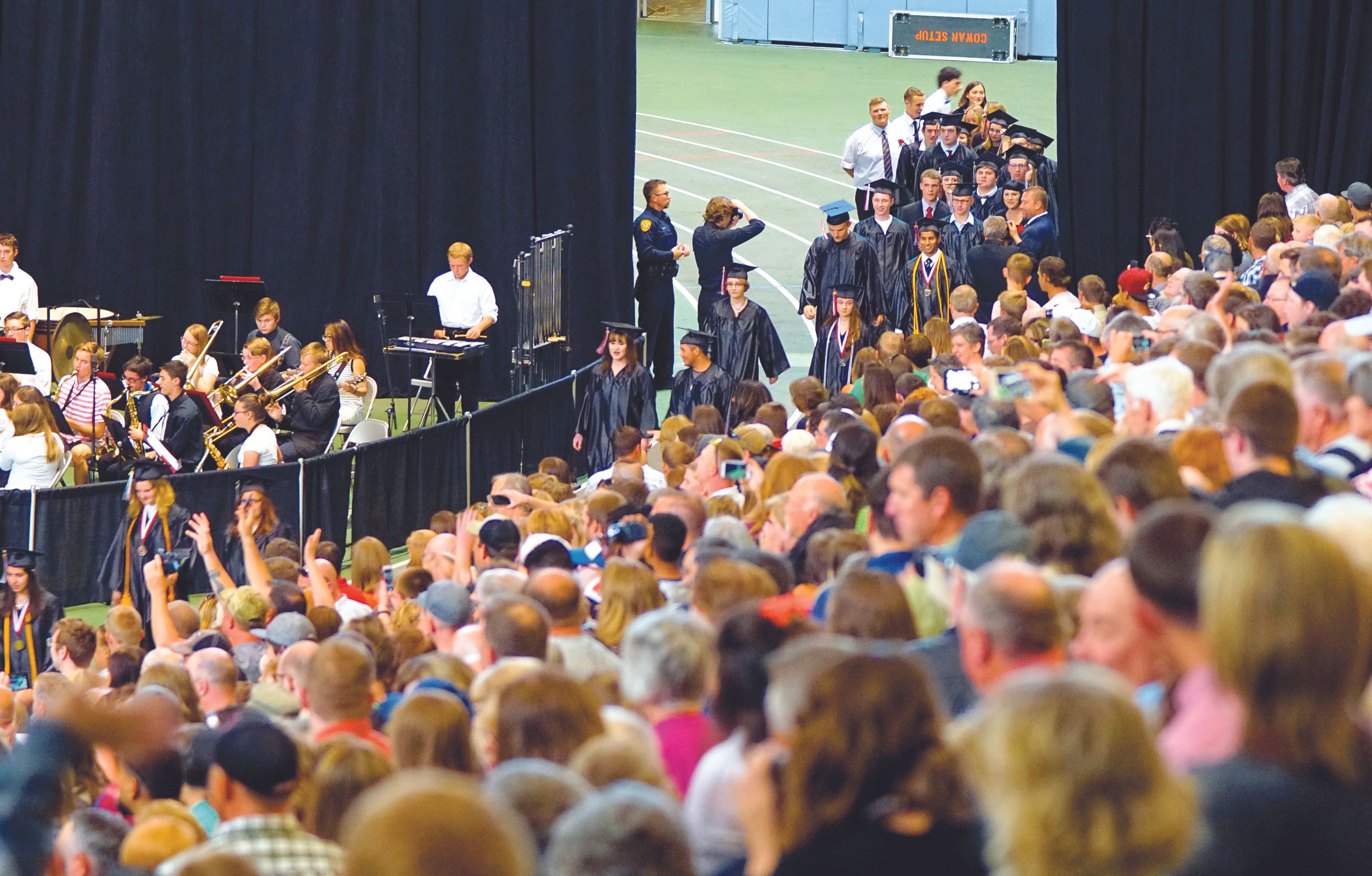 Members of Moscow High School's class of 2017 walk to their seats during the processional of the school's commencement ceremony Friday evening.