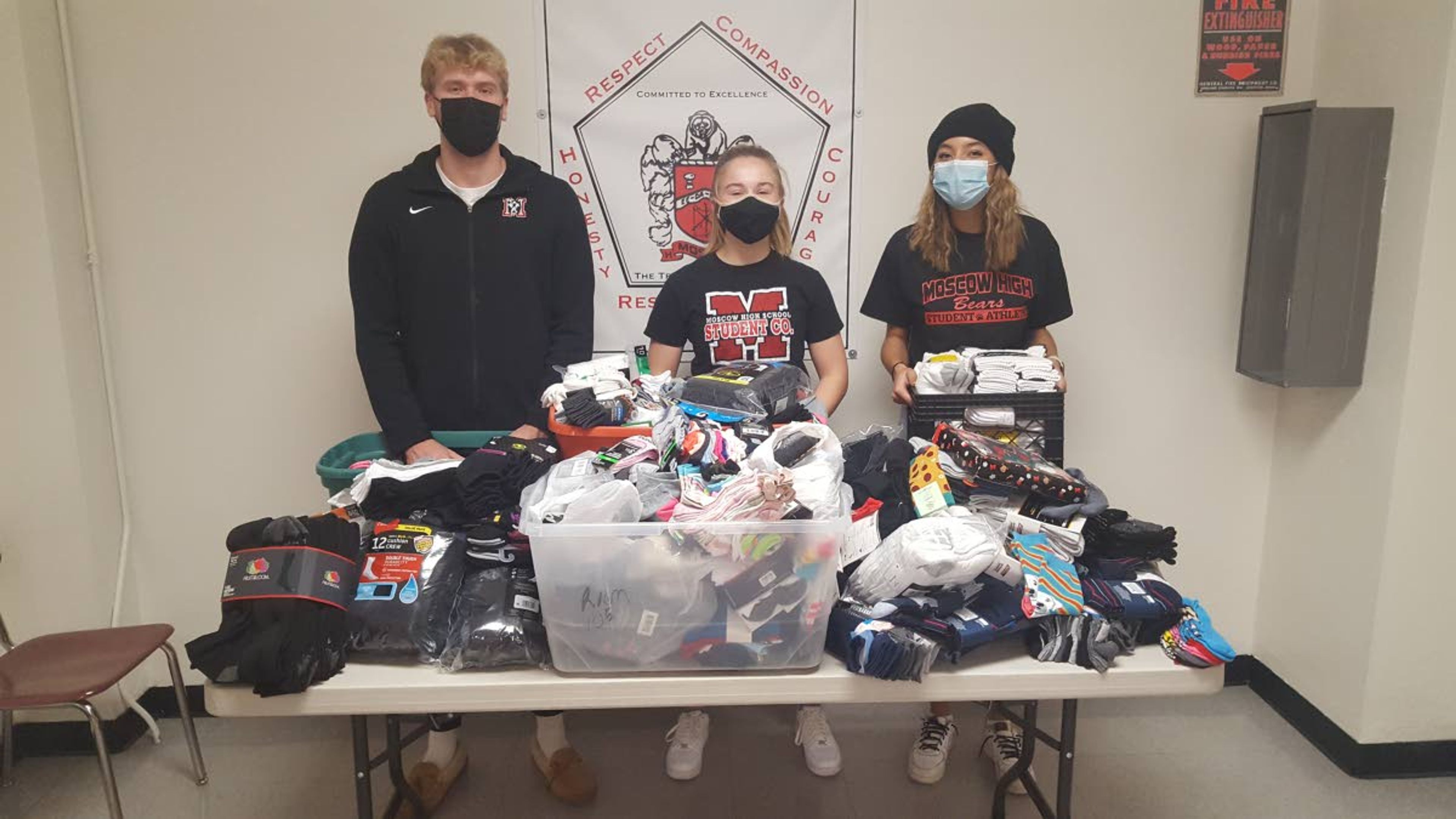 Moscow High School students, left to right, Benny Kitchel, Ava Jakich-Kunze and Amari Bethel organize piles of new socks they collected in the first ever student-led “No Bear Feet” sock drive. Students collected more than 1,100 pairs of socks in the drive. The socks will be distributed to community members in need. Two classes — taught by Ken Berger and Cory Voss — were treated to a complimentary breakfast courtesy of The Breakfast Club for collecting the highest amount of pairs in the school. Moscow High teacher Sam Hoogsteen snapped and submitted the photo.