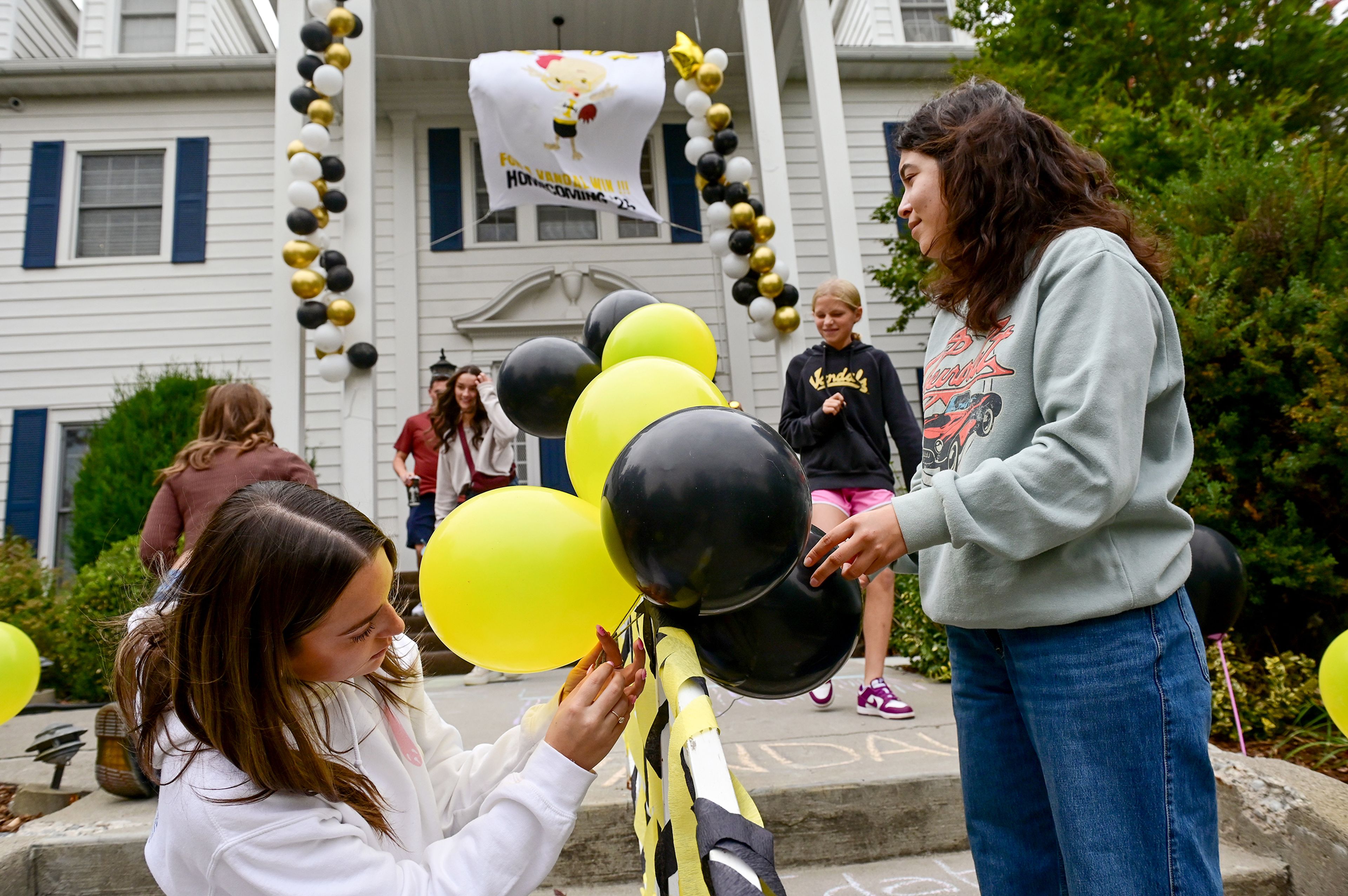 University of Idaho freshmen Alexis Wooters, left, and Sarah Rodriguez help decorate the Kappa Kappa Gamma house Friday in the theme of Chicken Little as part of the universitys overarching Where Vandal Dreams Come True theme for homecoming weekend in Moscow.,