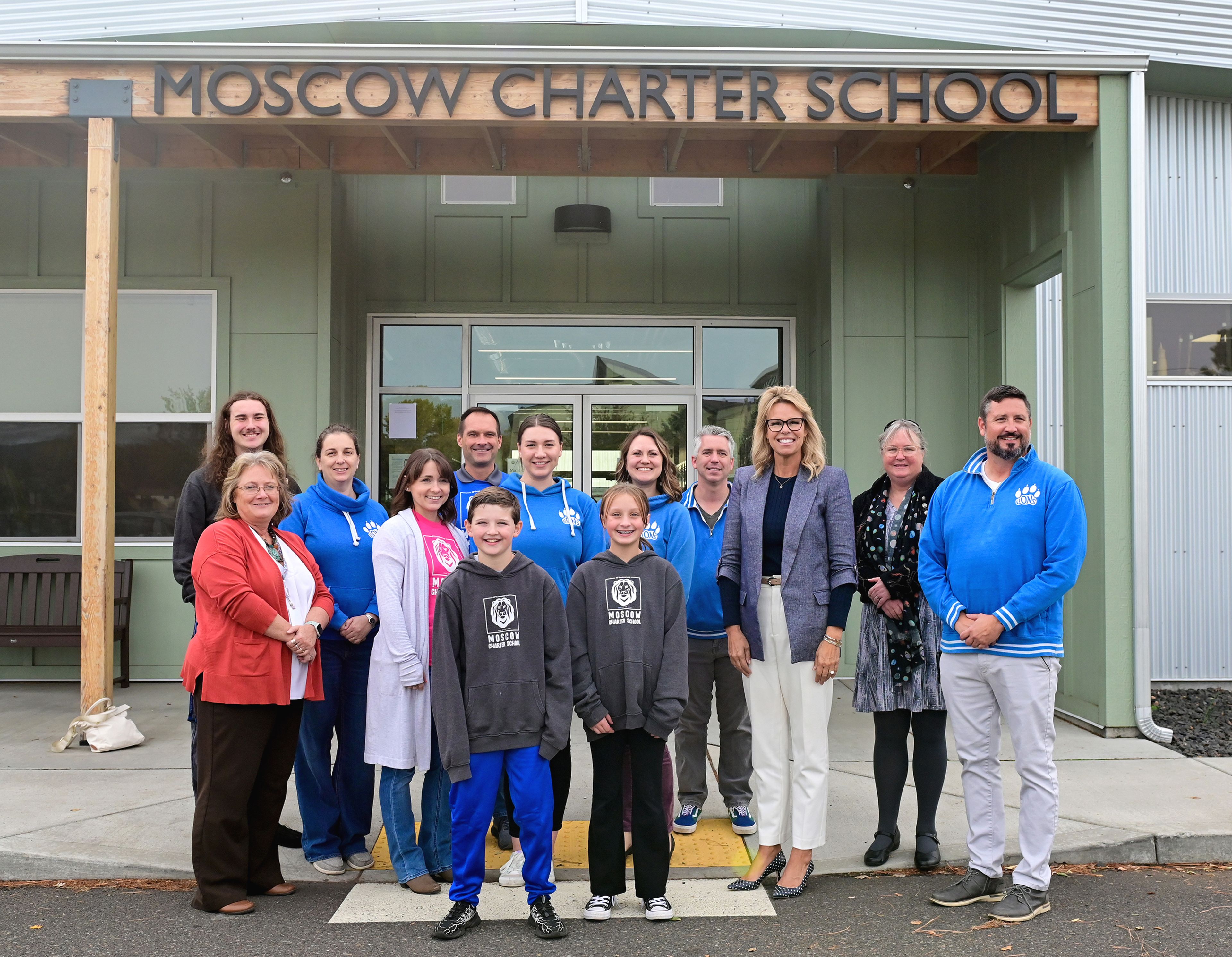 A collection of Moscow Charter School staff, students and board of directors pose with Idaho Superintendent of Public Instruction Debbie Critchfield and members of her staff on Critchfields visit to the school Friday in Moscow.