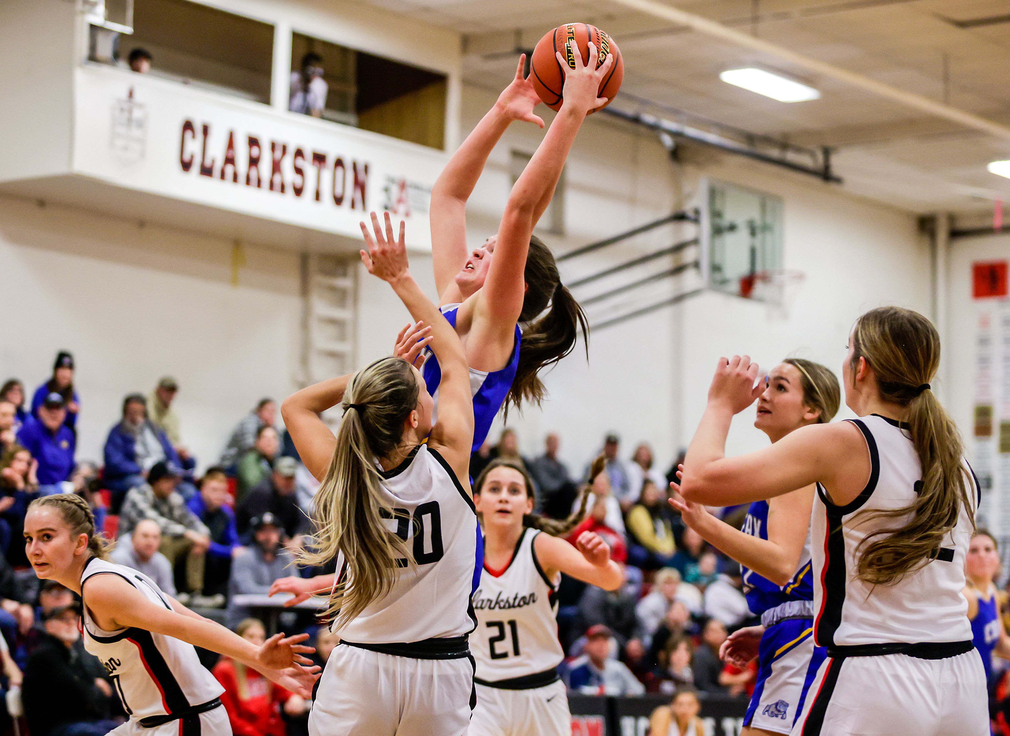 Colfax post Brynn McGaughy gets her hands on the rebound against Clarkston in a quarter of a nonleague game Thursday at Clarkston.