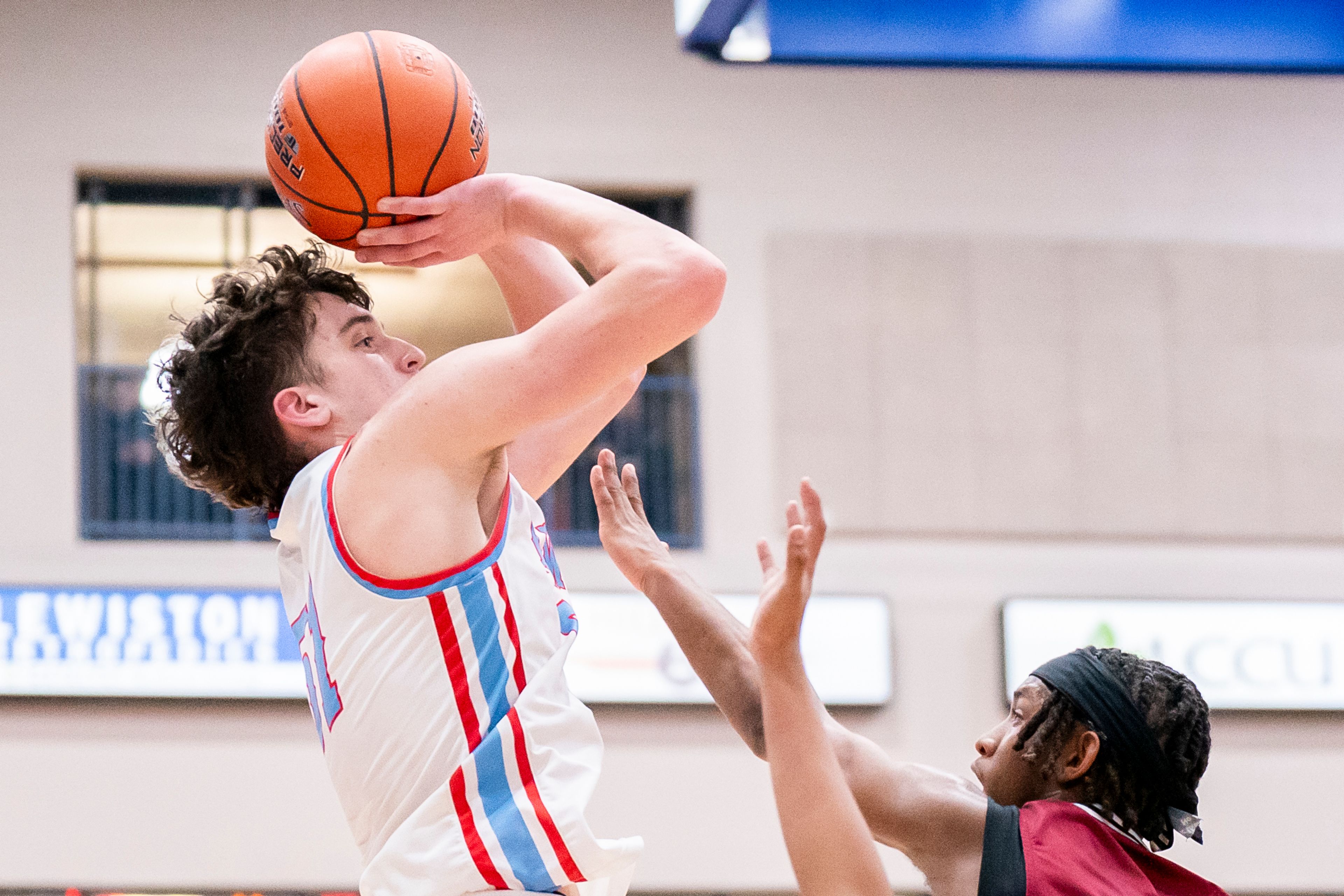 Lapwai’s Kase Wynott, left, shoots the ball during their game against Downey in the first round of the Avista Holiday Basketball Tournament on Thursday inside the P1FCU Activity Center in Lewiston.