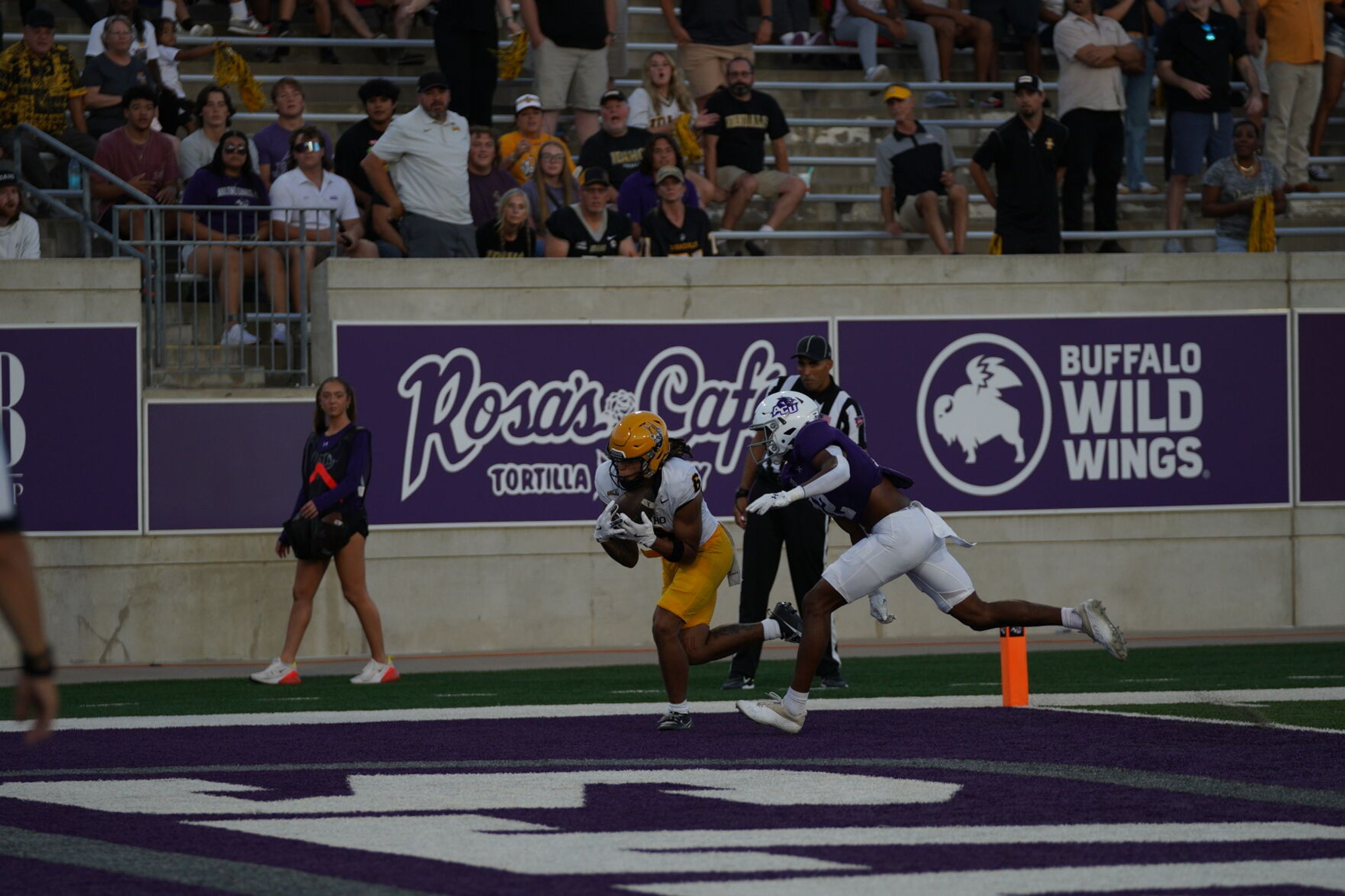 Idaho wide receiver Jordan Dwyer, left, makes a touchdown catch against an Abilene Christian defender during a game Saturday, Sept. 21, in Abilene, Texas.