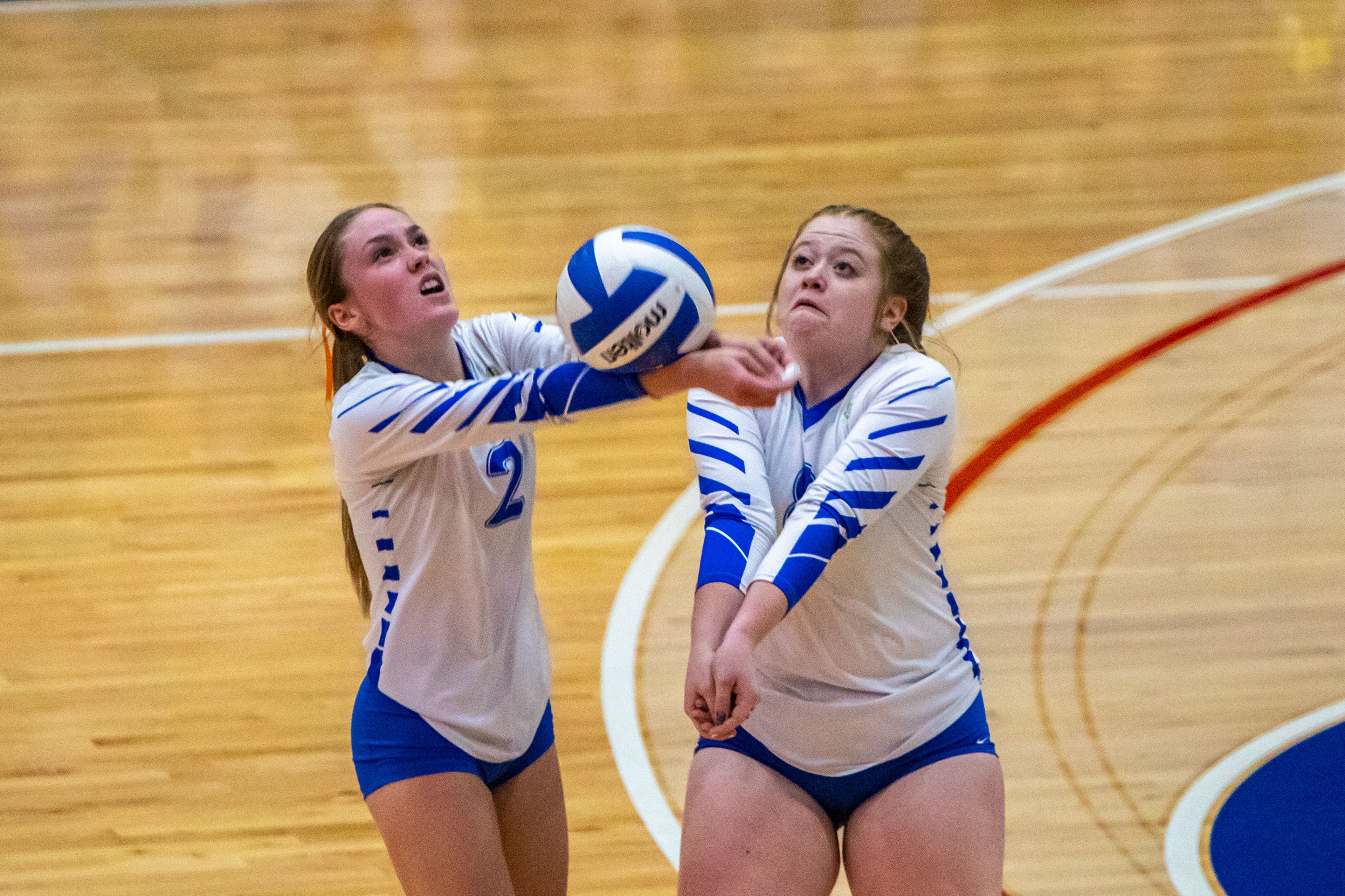 Genesee High’s Makenzie Stout, left, and Shelby Hanson both go a for a volley during the Idaho Class 1A Division I district volleyball tournament against Troy High at the P1FCU Activity Center in Lewiston on Wednesday.