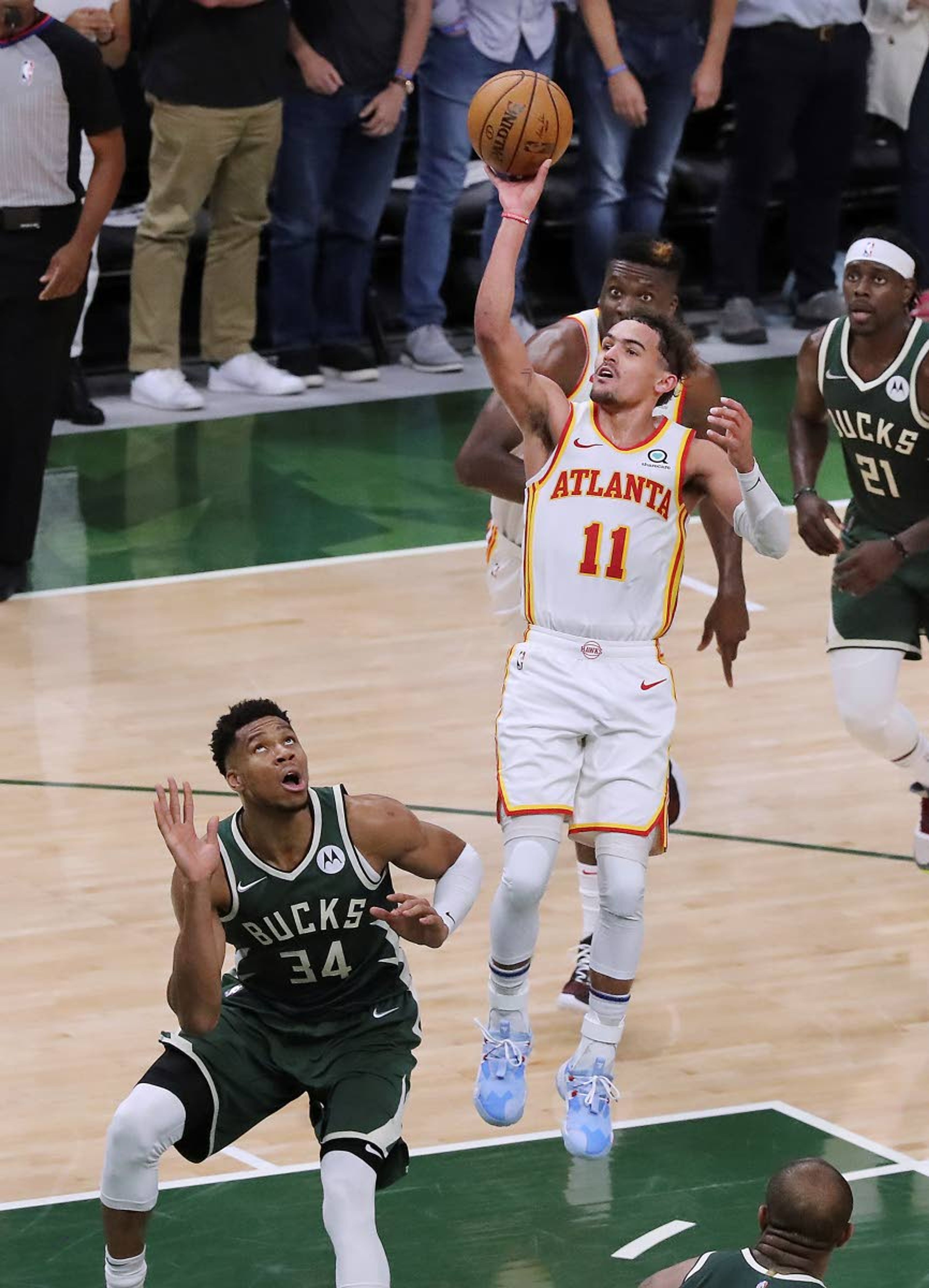 Associated PressHawks guard Trae Young shoots over Bucks forward Giannis Antetokounmpo during the second half of Game 1 of the NBA Eastern Conference finals game Wednesday in Milwaukee.