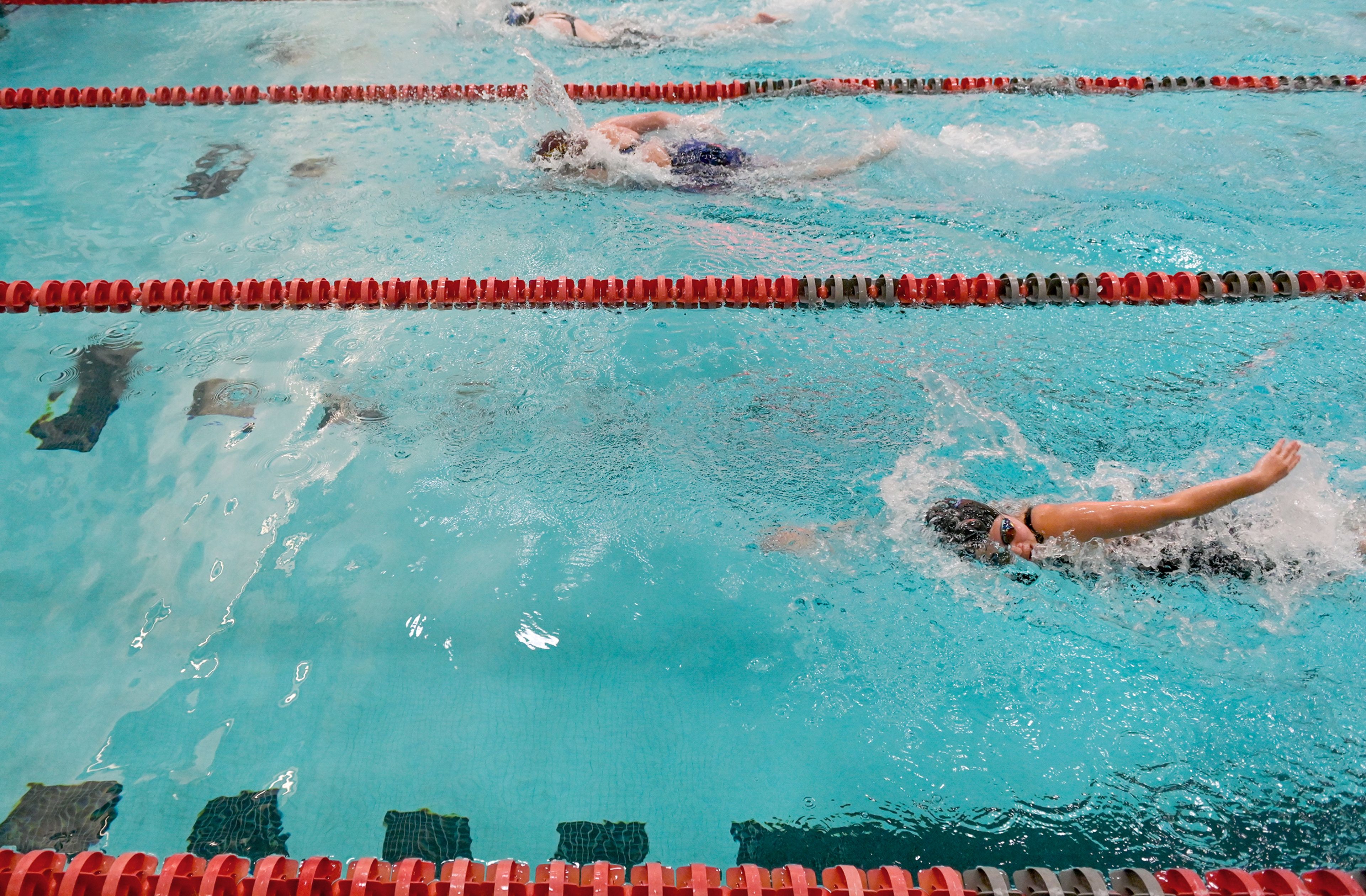 Pullman junior Vivien Lin, front, competes in a 50-yard freestyle Thursday at the Eastern Washington District Swim Championship at Washington State University in Pullman.