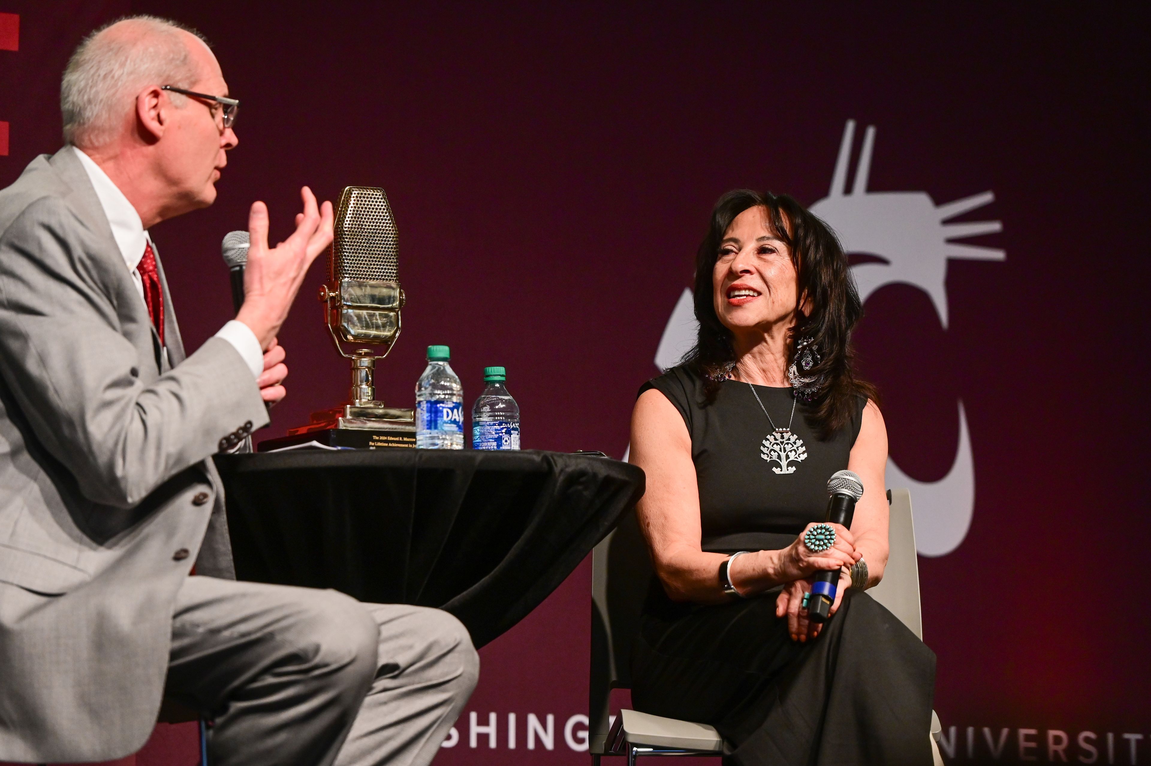 Bruce Pinkleton, left, dean of the Edward R. Murrow College of Communication, asks Maria Hinojosa questions after her keynote at the Murrow Symposium in Pullman on Wednesday. Hinojosa is the 2024 recipient of the Murrow Lifetime Achievement Award.