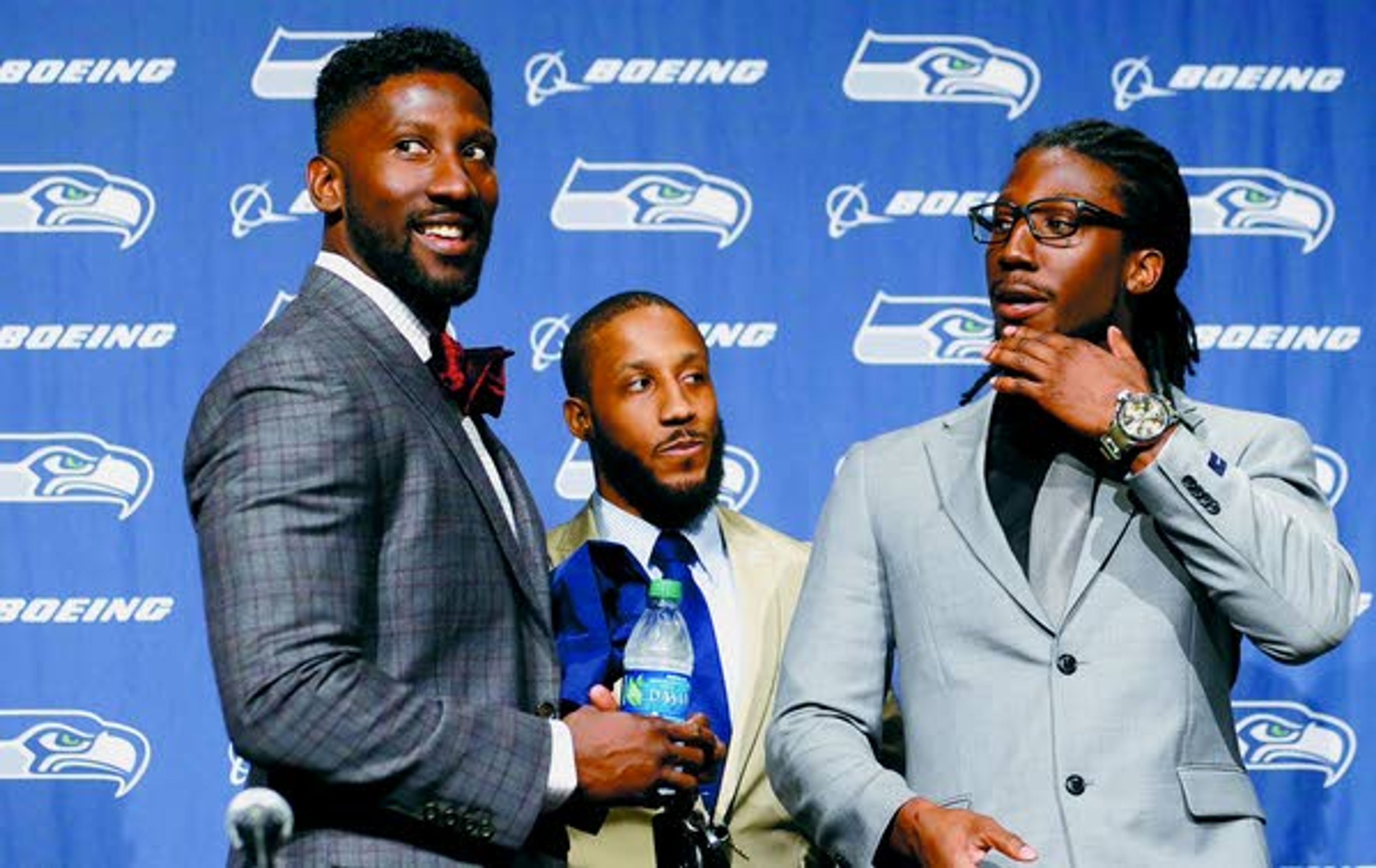 Seahawks’ Marcus Trufant, left, is joined by his brothers Isaiah, center, and Desmond after a news conference announcing his retirement from football Thursday in Renton, Wash. Marcus Trufant started 125 games in a Seattle career that lasted from 2003 to 2012. The cornerback was a first-round pick in 2003 out of Washington State.