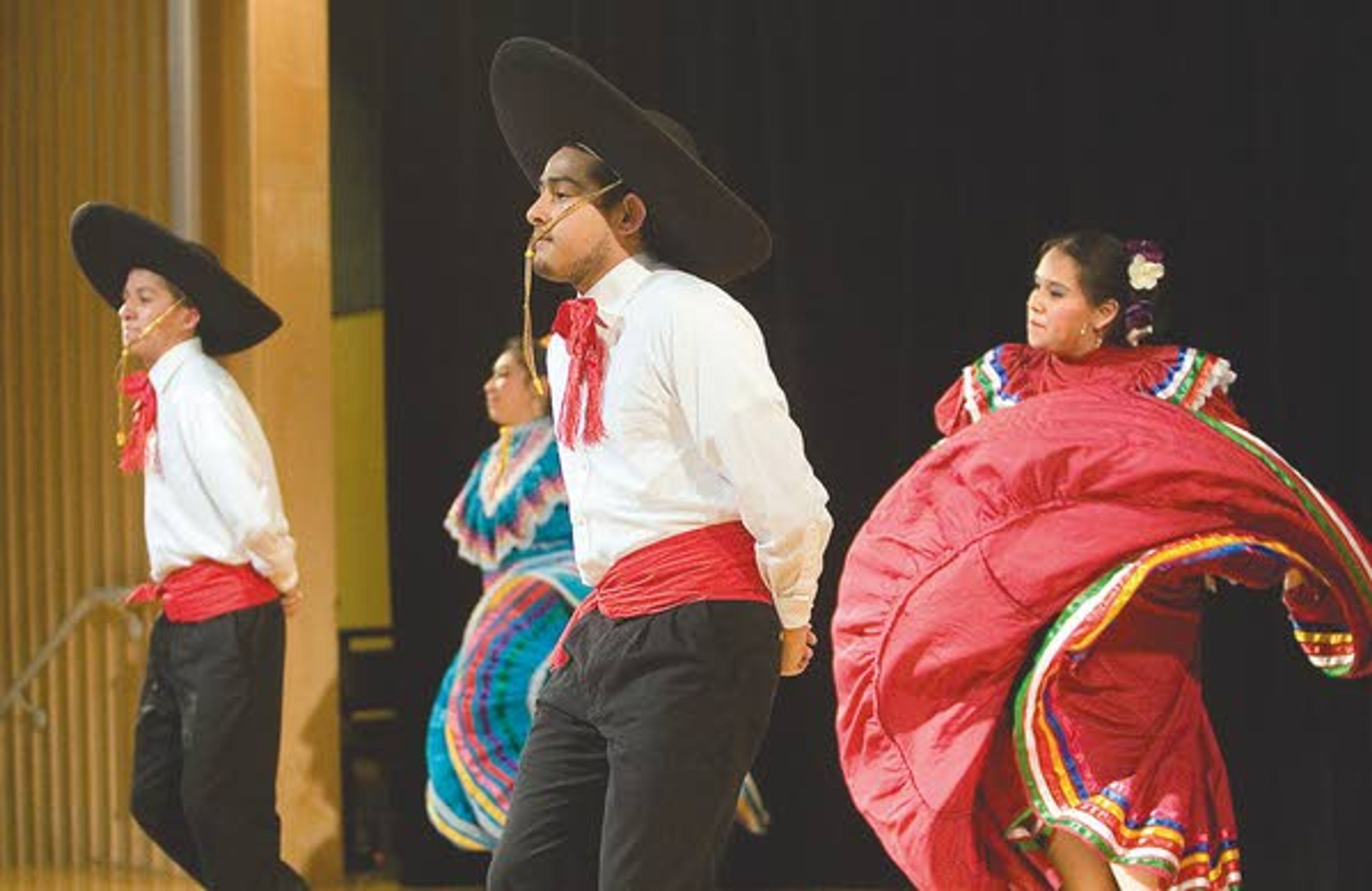 Sabor de la Raza performs a dance from Mexico during Cruise The World at the Student Union Building in Moscow on Saturday.