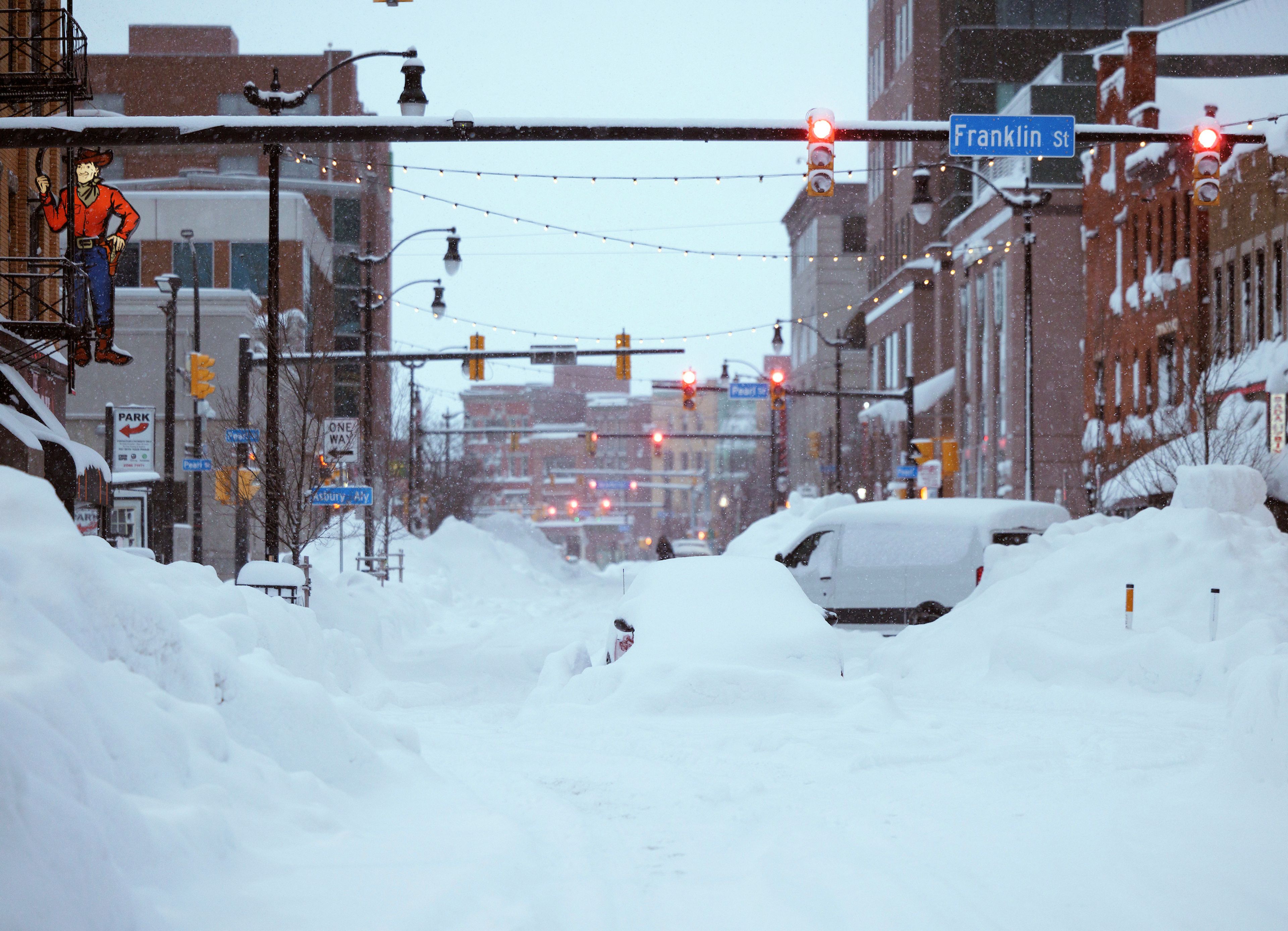 This photo provided by the Twitter page of New York Gov. Kathy Hochul, snow from this weekends blizzard covers downtown Buffalo on Monday, Dec. 26, 2022. The blizzard roared through western New York Friday and Saturday, stranding motorists, knocking out power and preventing emergency crews from reaching residents in frigid homes and stuck cars. (Twitter page of New York Gov. Kathy Hochul via AP)