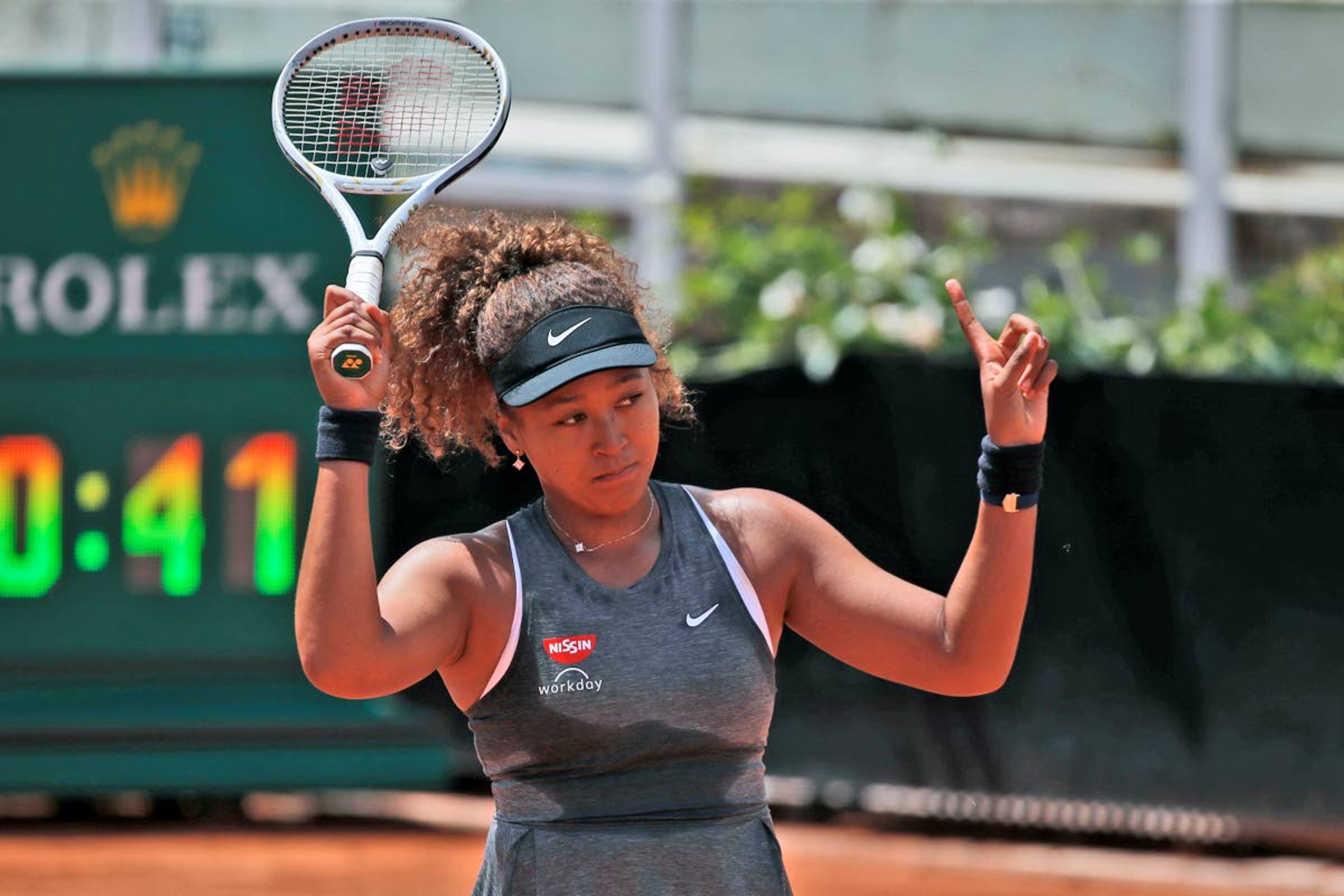 FILE - In this May 12, 2021, file photo, Naomi Osaka of Japan reacts after losing a point against Jessica Pegula of the United States during their match at the Italian Open tennis tournament, in Rome. Osaka’s agent says the four-time Grand Slam champion will sit out Wimbledon and compete at the Tokyo Olympics. Stuart Duguid wrote Thursday, June 17, 2021, in an email that Osaka “is taking some personal time with friends and family. She will be ready for the Olympics and is excited to play in front of her home fans.” (AP Photo/Alessandra Tarantino, File)