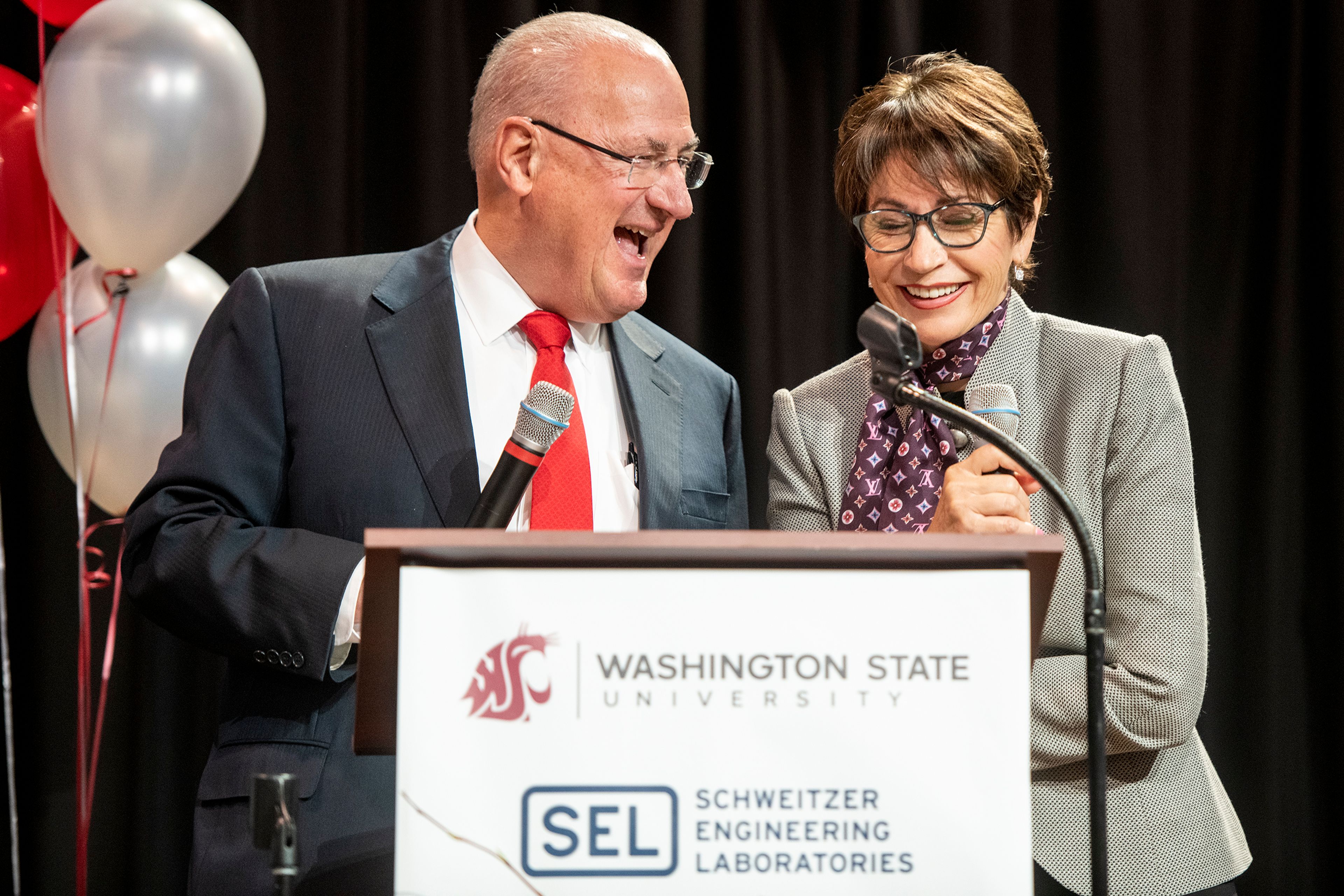 Schweitzer Engineering Laboratories President Ed Schweitzer and Director of Community Outreach Beatriz Schweitzer share a laugh while speaking about the long-standing relationship between SEL and Washington State University at the SEL Event Center on Monday morning in Pullman. SEL and the Schweitzers donated a combined $20 million to the university to construct a new building on the WSU Pullman campus. Zach Wilkinson/Daily News