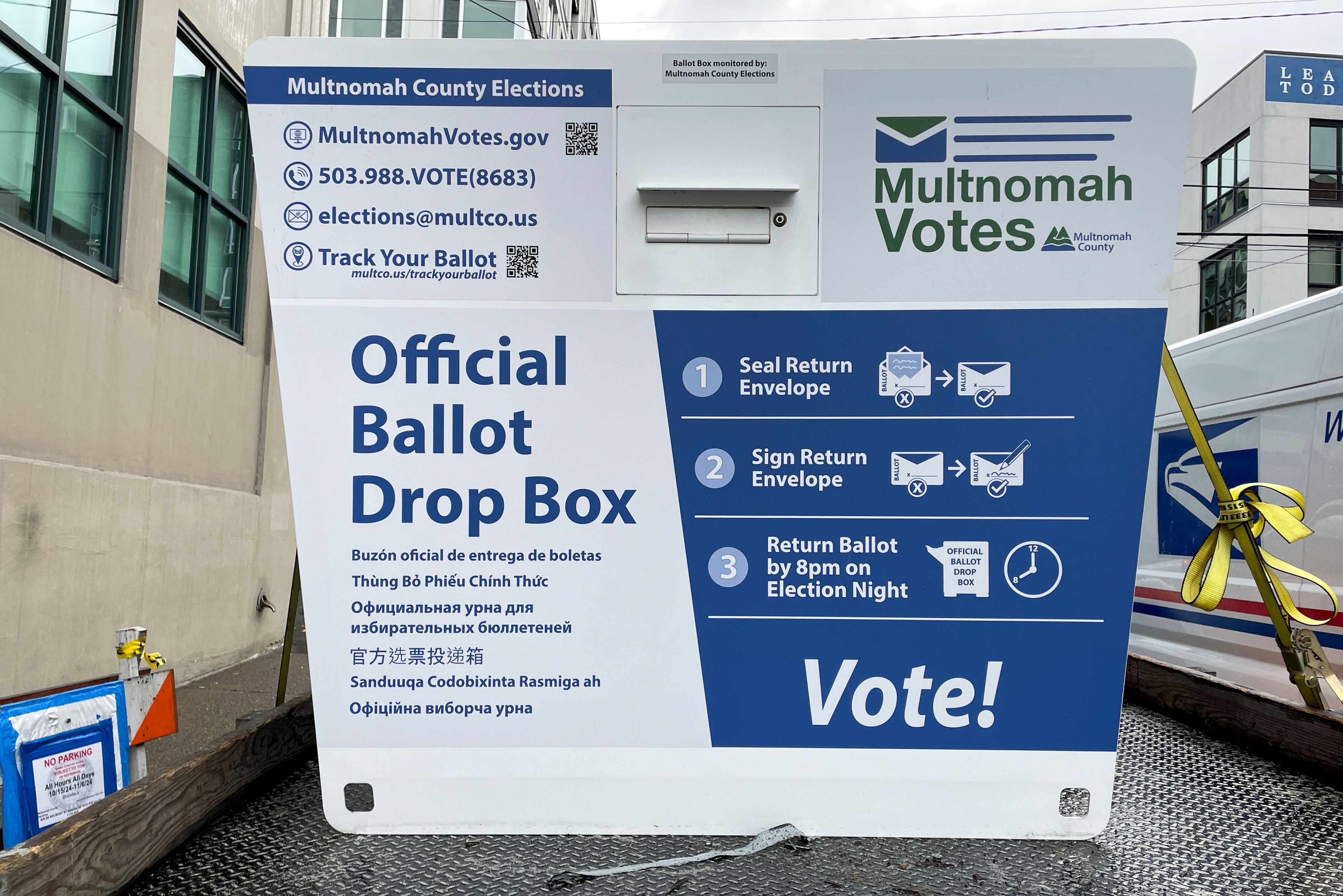 A new ballot drop box is unloaded on Monday, Oct. 28, 2024, in Portland, Ore. The Portland Police Bureau reported that officers and firefighters responded to a fire in one ballot drop box on Monday morning. (AP Photo/Claire Rush)