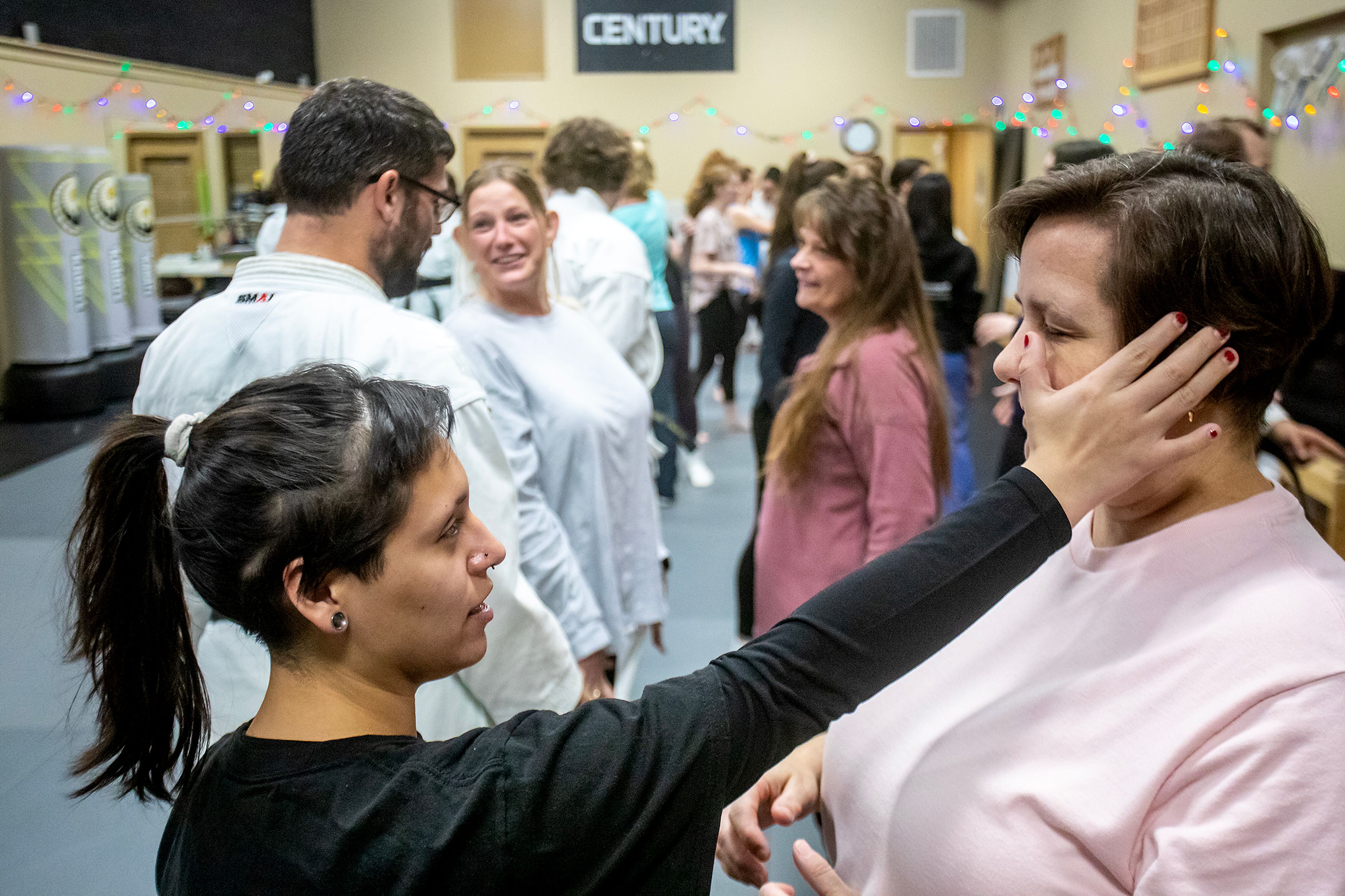 Mari Monize, left, and Willie Summers practice gouging the eye in Chris Schwartz’s self-defense class at Northwest Wado-ryu karate Thursday last week in Moscow.