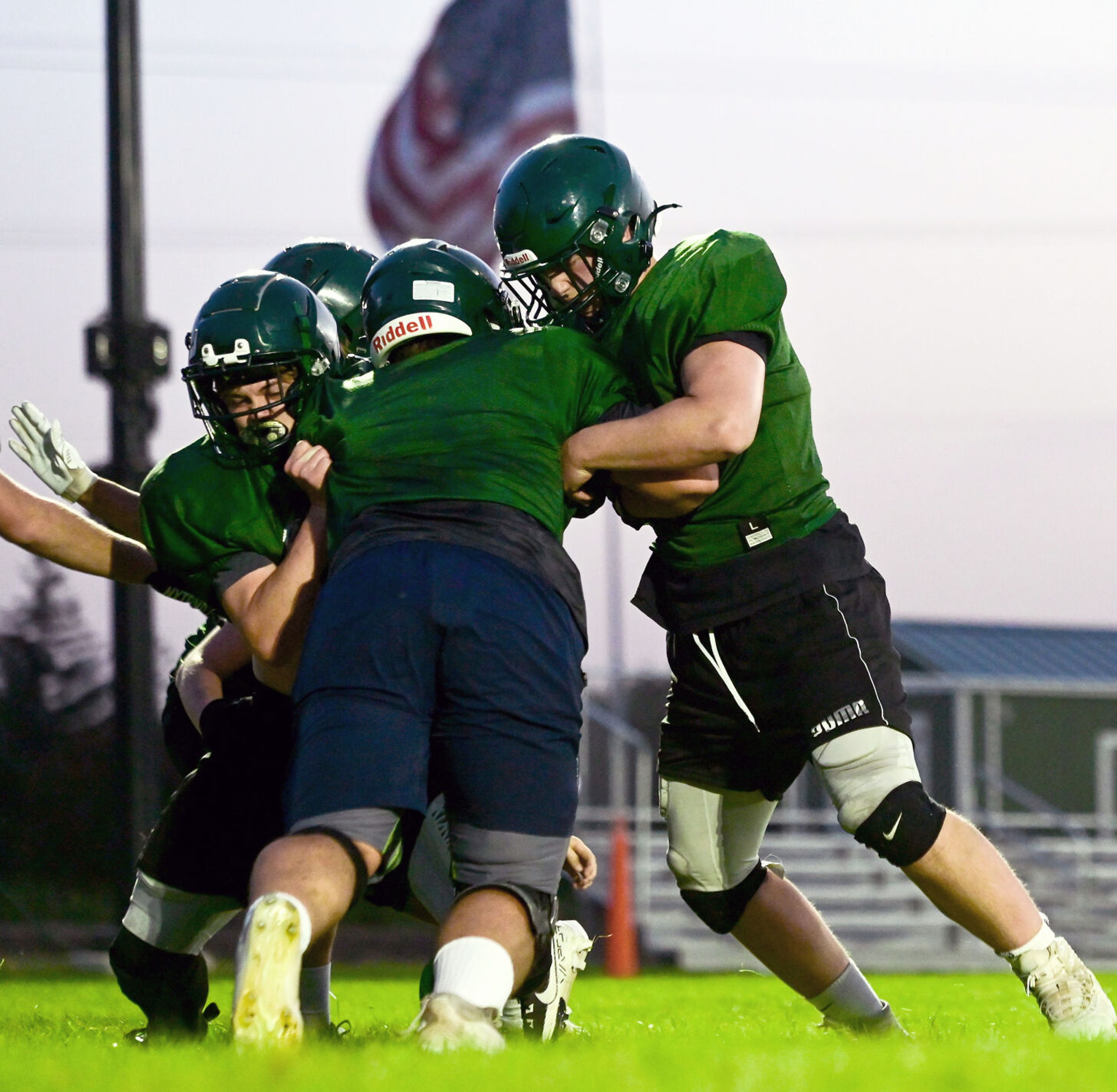 Potlatch players collide during play run-throughs at practice on Tuesday.