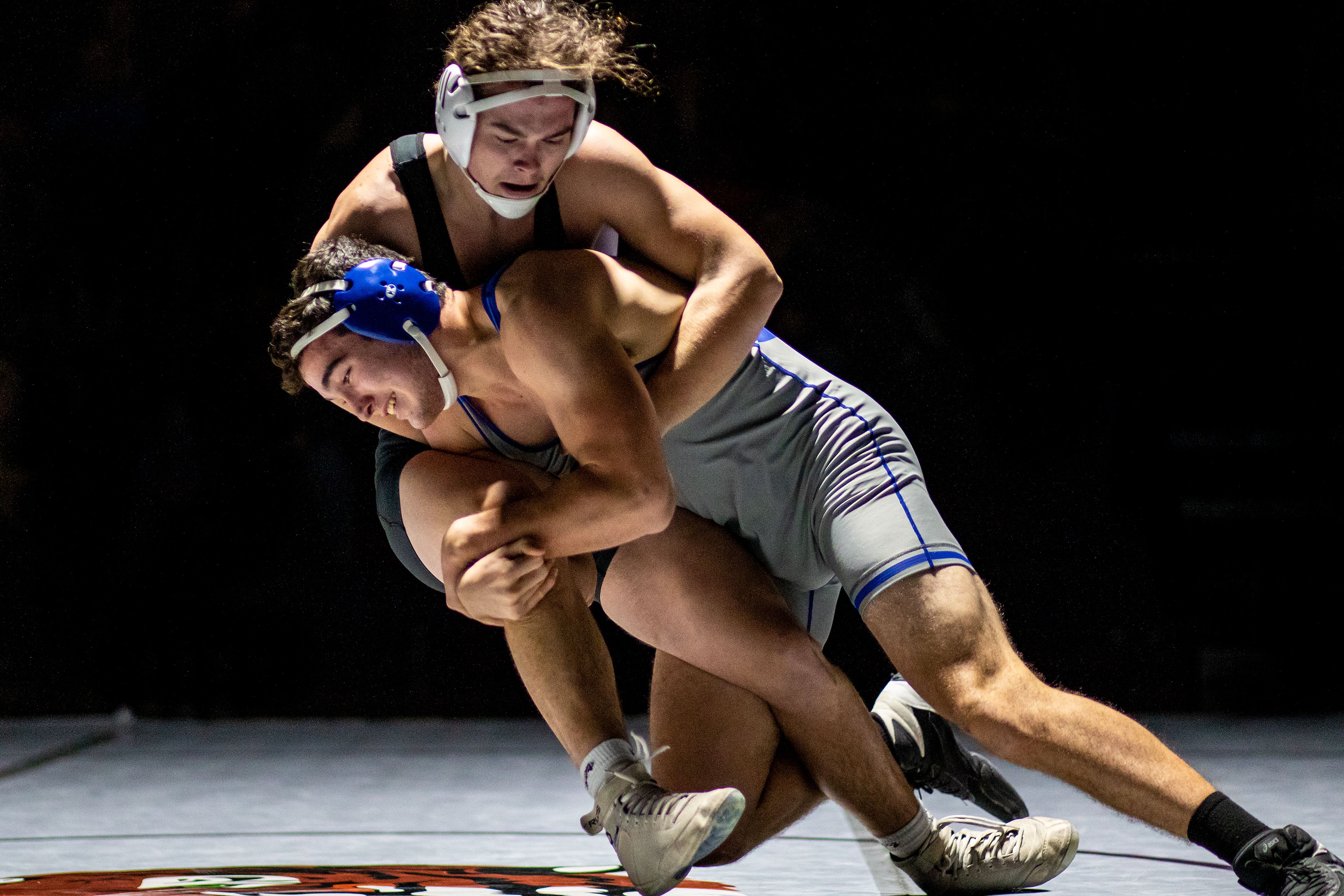 Pullman’s Samuel Sears, bottom, takes Lewiston’s Brenden Thill to the mat Tuesday in the 195-pound weight class during a varsity wrestling match at Lewiston High.