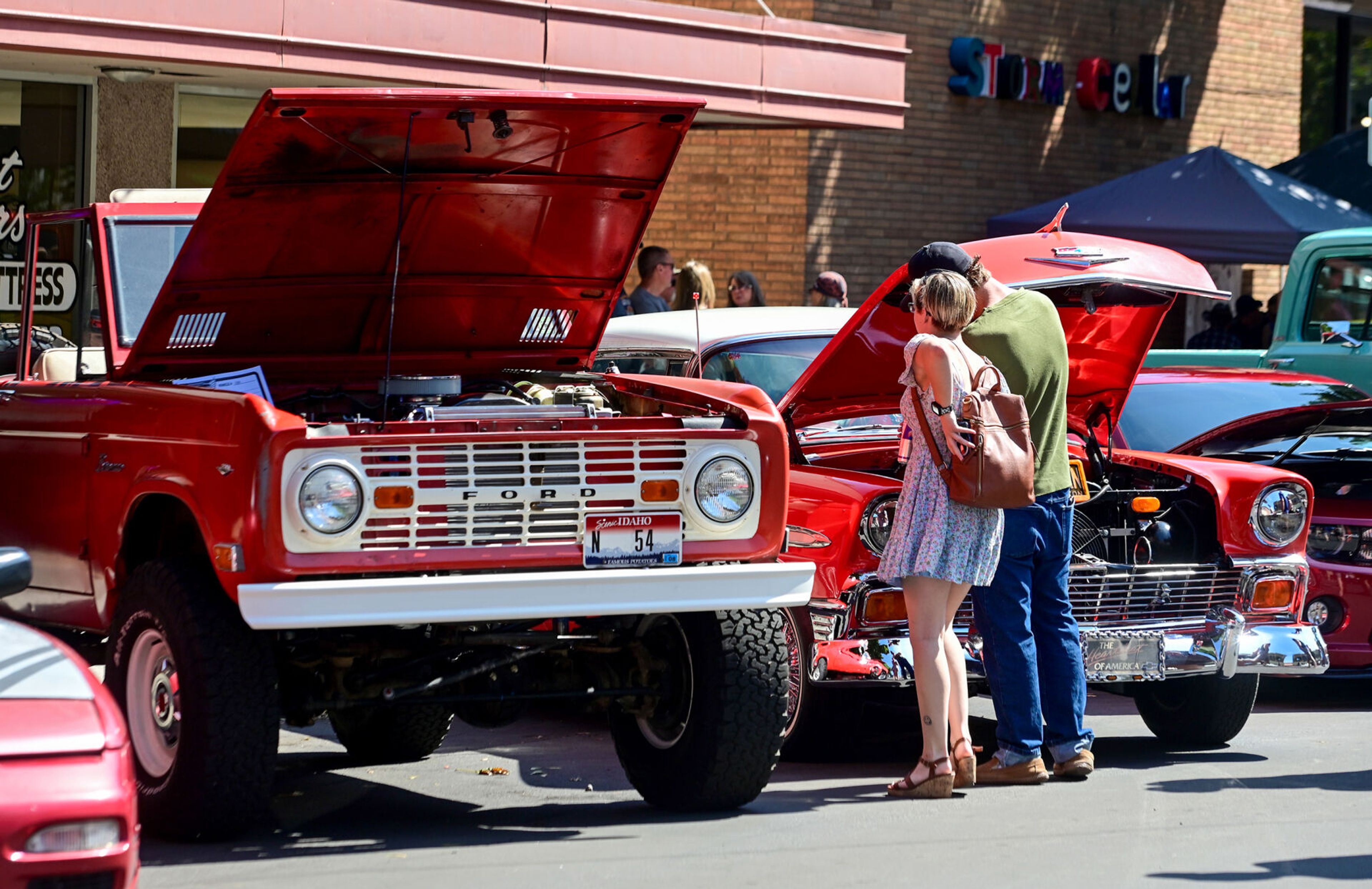 People stop along Main Street to get a closer look at the cars on display for the Lewiston Hot August Nights on Saturday.