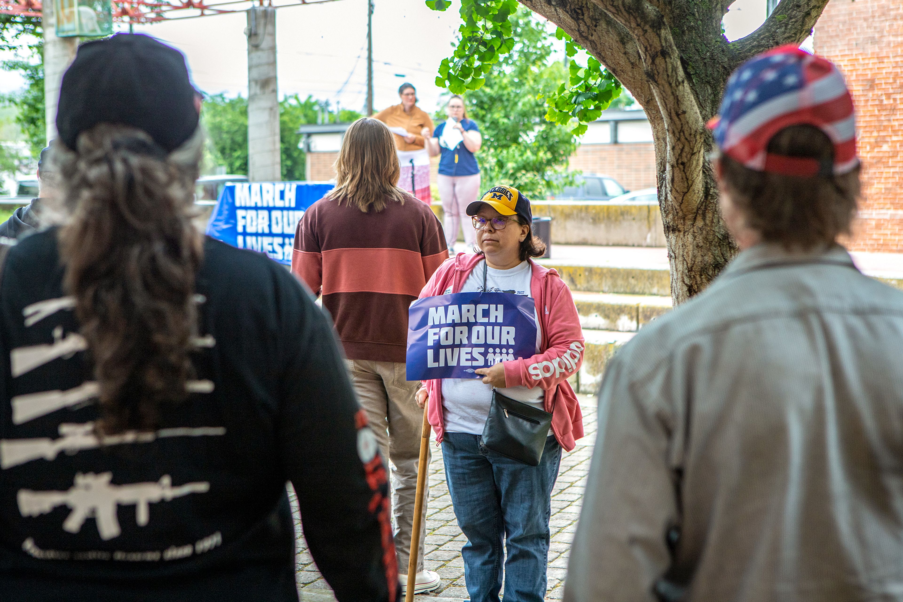 A gun violence protestor, center, keeps an eye on a group of counter protestors after a verbal confrontation between the two groups during a March for Our Lives rally Saturday morning at Brackenbury Square in downtown Lewiston. March for Our Lives rallies protesting gun violence were held across the country today after the recent occurance of horrific mass shootings in towns like Uvalde, Texas and Buffalo, New York.