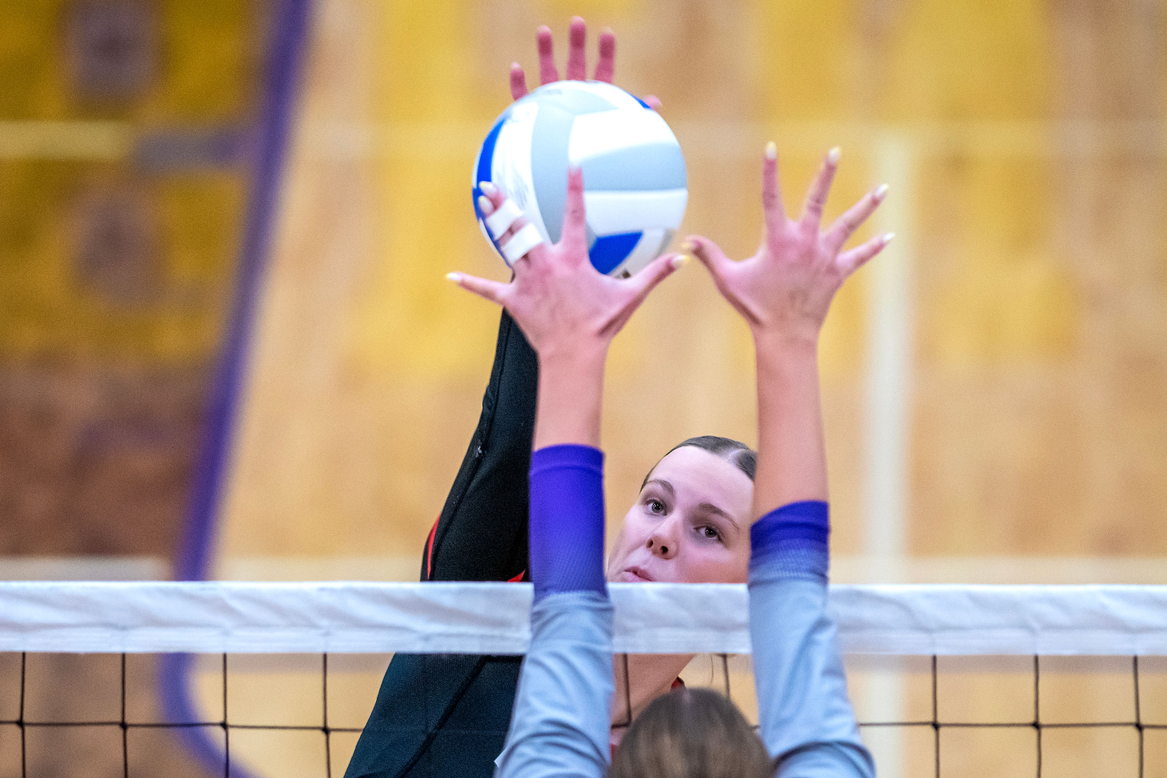 Moscow outside hitter Jesse Skinner spikes the ball against Lewiston in a 5A district tournament match Tuesday in Lewiston.